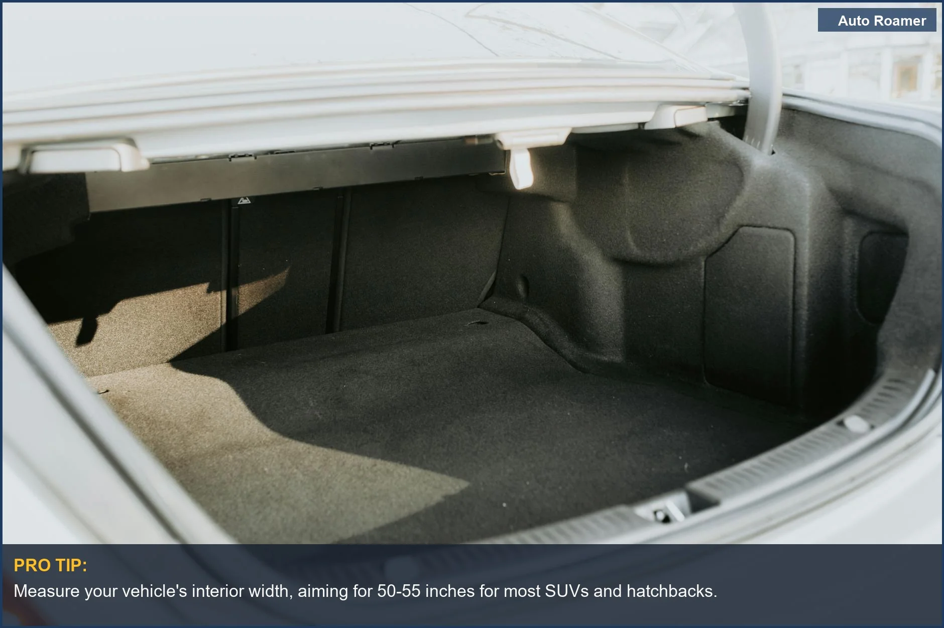 Ample car trunk space for a two person sleeping pad, illuminated by sunlight.
