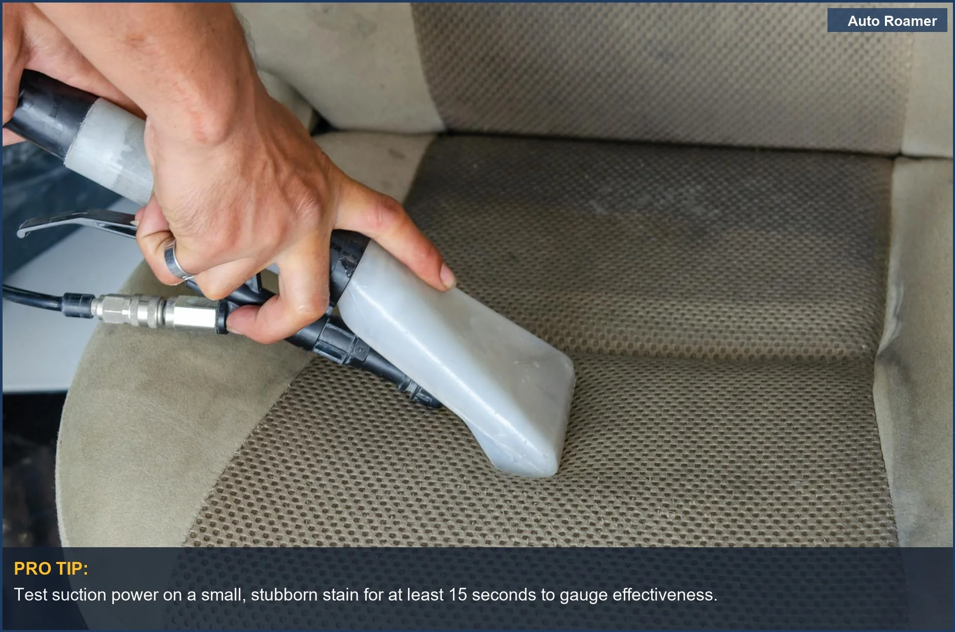 Deeply cleaning fabric car seats with a powerful cordless vacuum nozzle to remove embedded dirt and pet hair.
