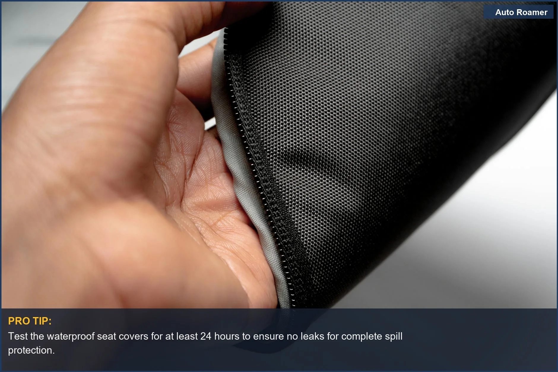 Close-up of waterproof black textile material with zipper, highlighting durable seat covers for pets.