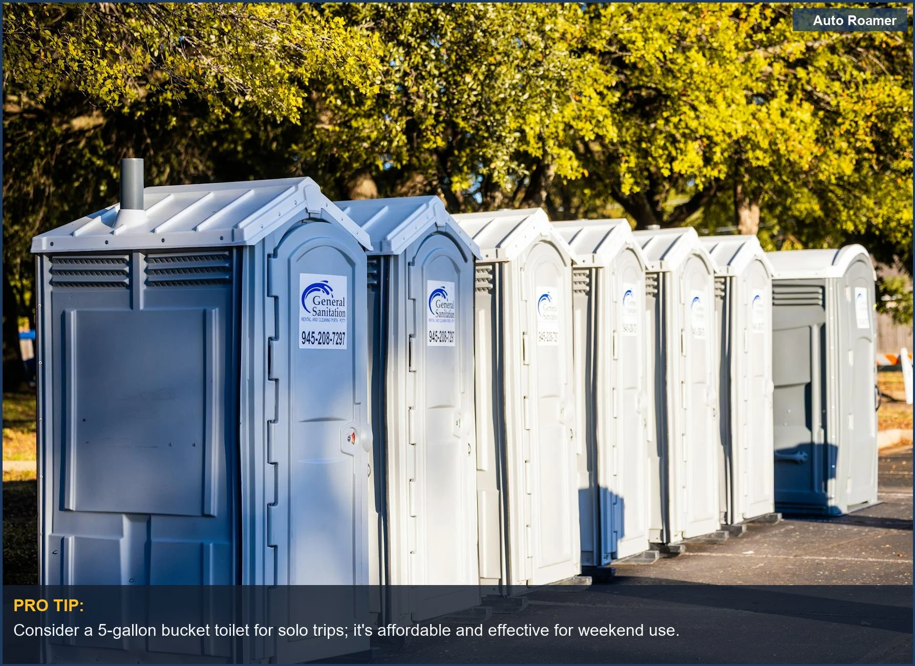 Several portable camping toilets lined up outdoors, demonstrating various camping toilet capacity options for different needs.