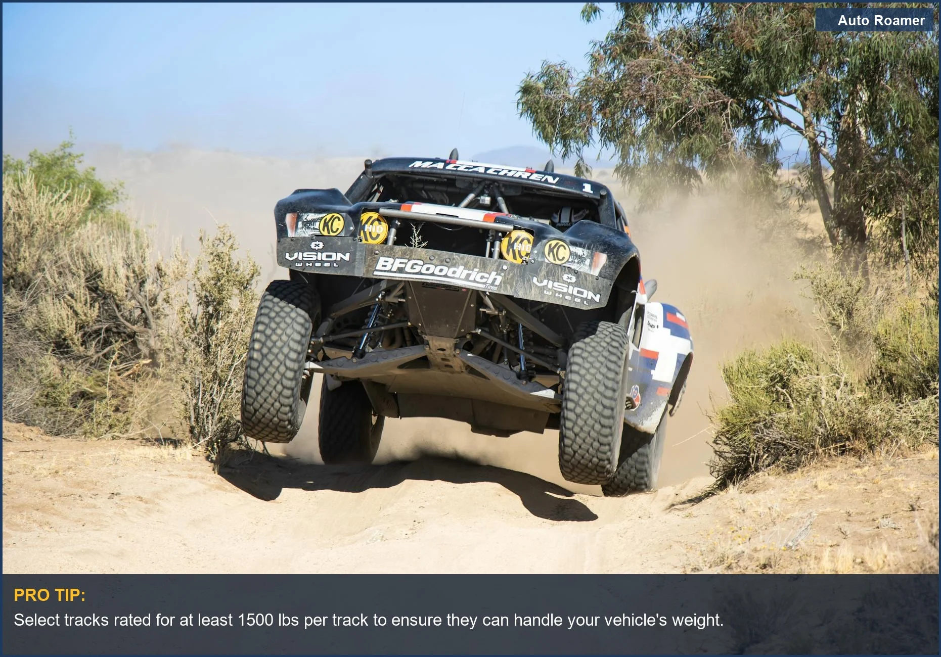 All-terrain vehicle kicking up dust while racing through a rugged desert, demonstrating the need for vehicle traction.