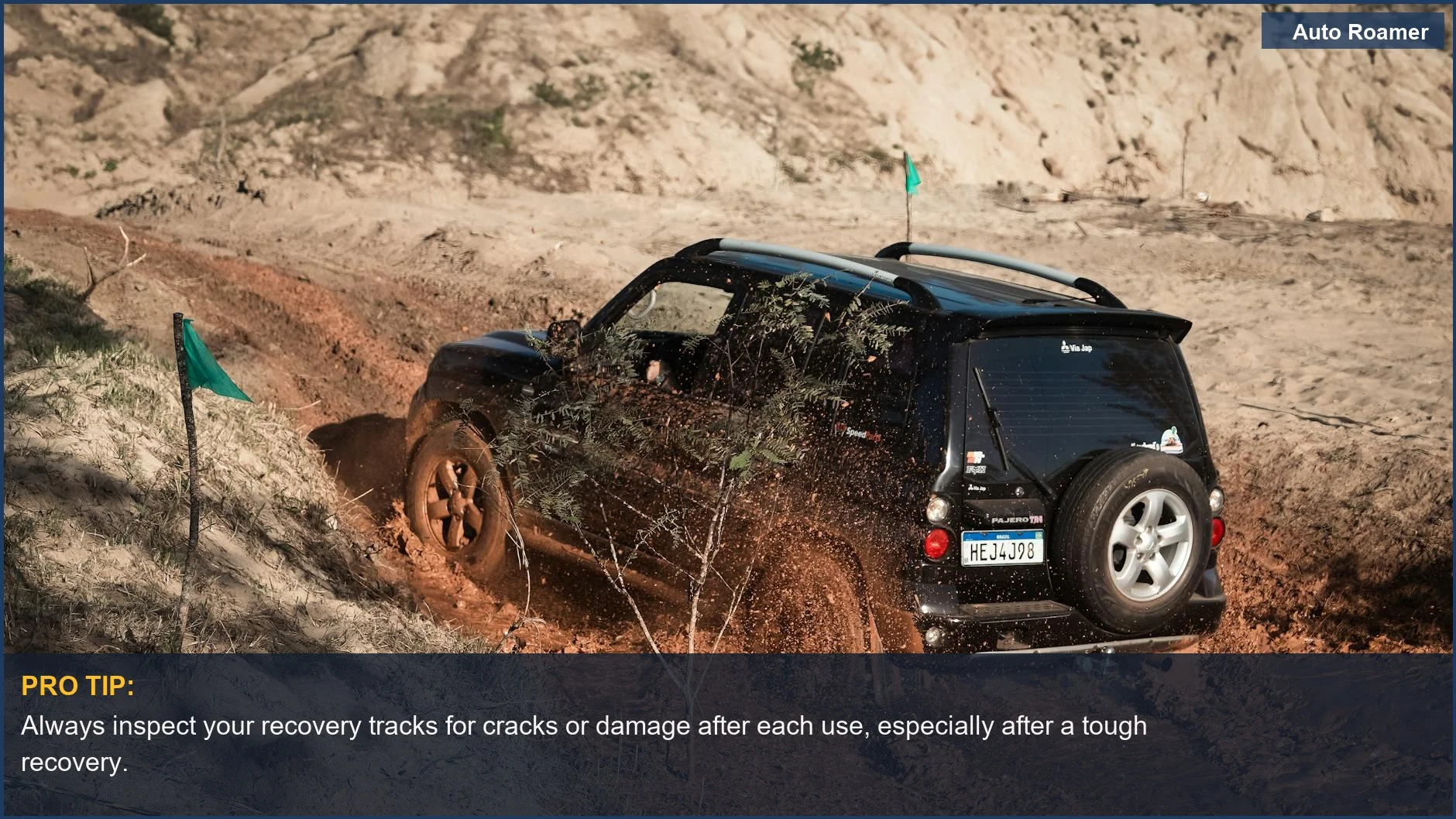 SUV navigating a muddy off-road trail, highlighting the importance of durable recovery track material.