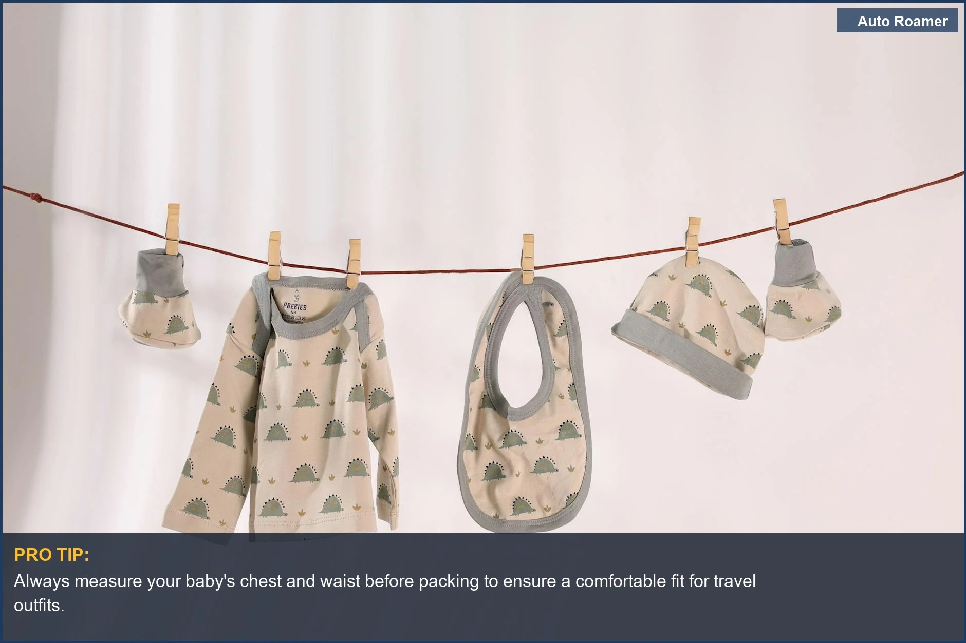 Cute baby clothes with playful patterns hanging on a line, ideal for checking baby travel clothing size.