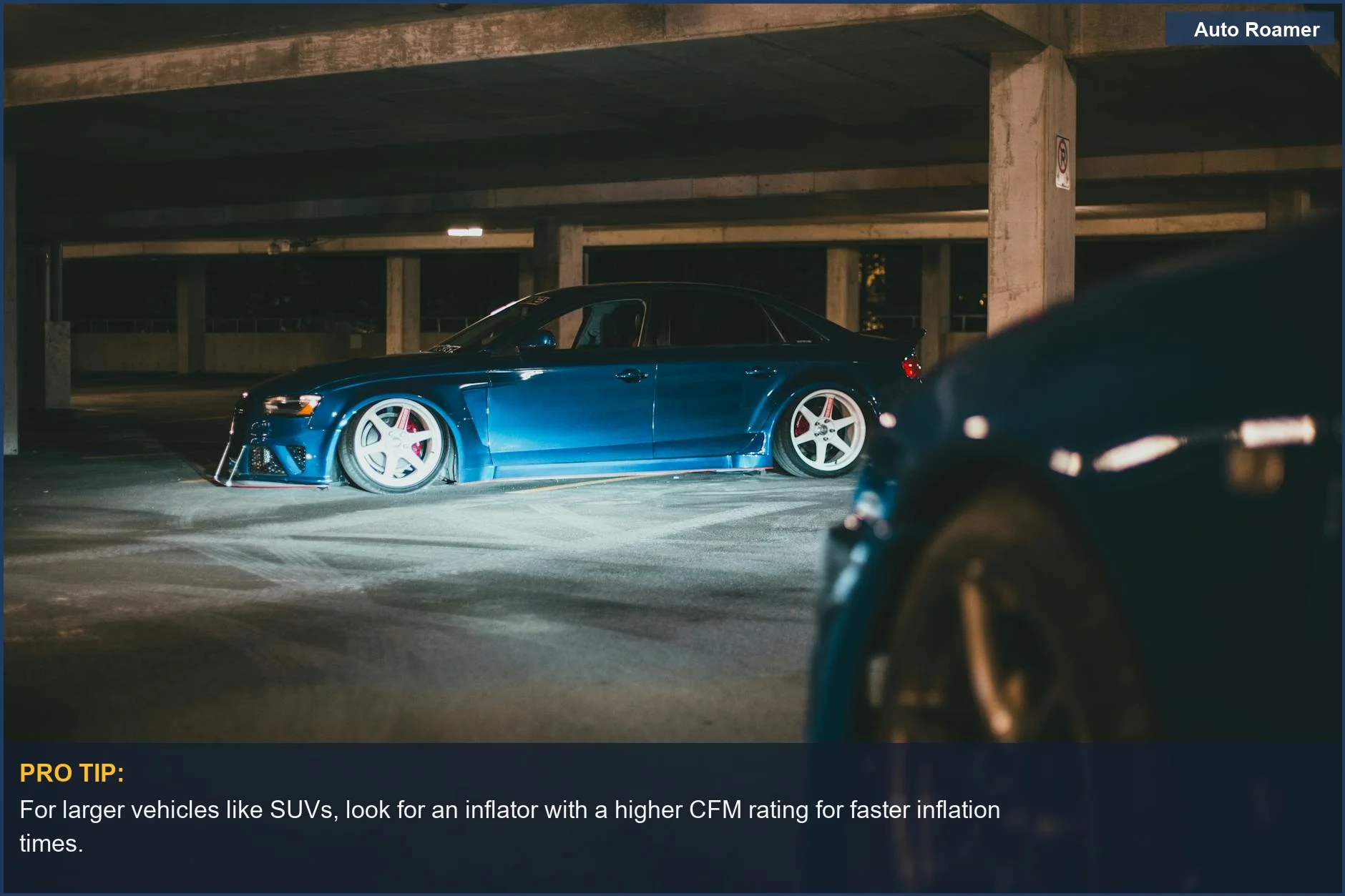 Stylish blue sedan parked in a dark garage, highlighting the importance of SUV tire inflator power for larger vehicles.