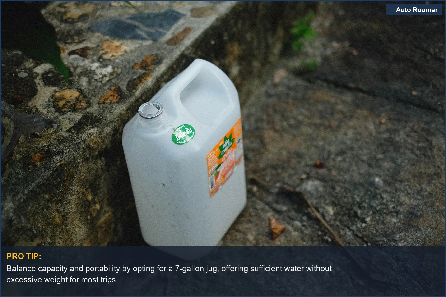 Large white plastic water jug on a textured stone surface, perfect for car camping water storage.