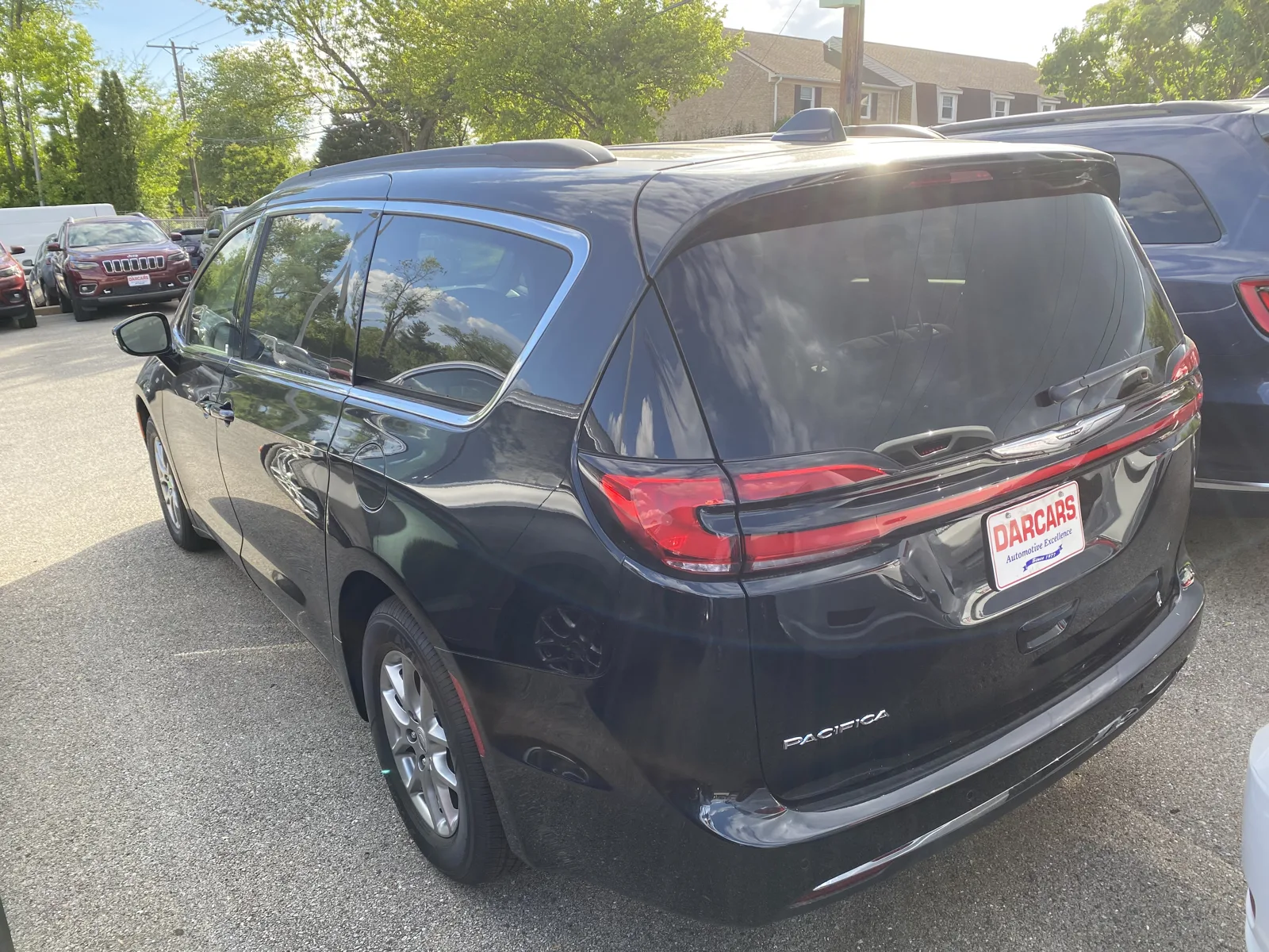 A black Chrysler Pacifica minivan seen from the rear, the sleeping platform this cargo-dimensions guide is about