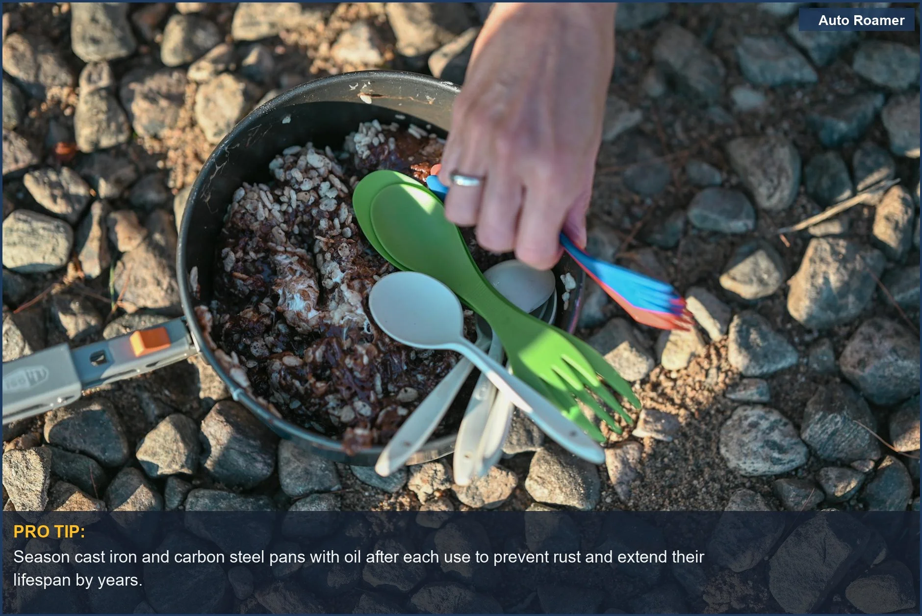 Close-up of a camping cooking pot with rice and utensils, highlighting the importance of maintaining camping pans.