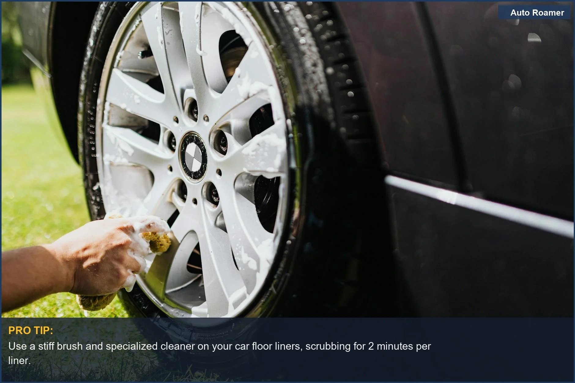Detailed shot of a car wheel being cleaned at home, focusing on car floor liner cleaning.