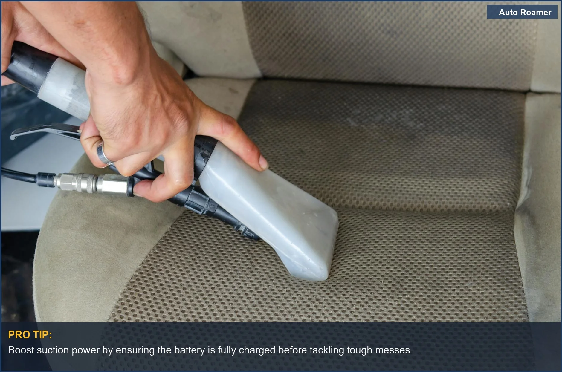 Woman deep cleaning fabric car seat with cordless car vacuum, removing visible dirt and stains.