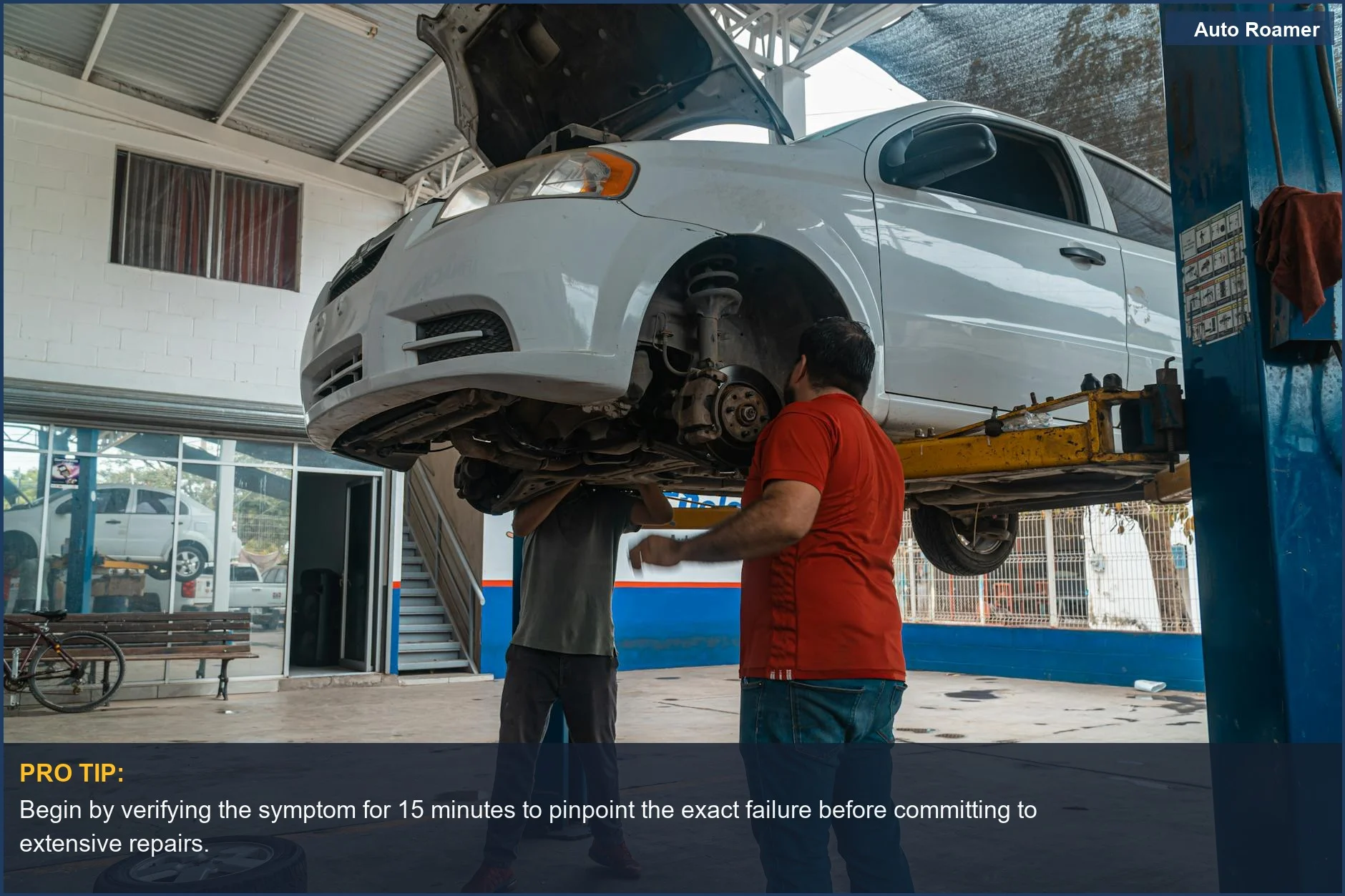 Two mechanics inspect a car on a lift, showing the diagnostic steps for heated and cooled seat repair costs.
