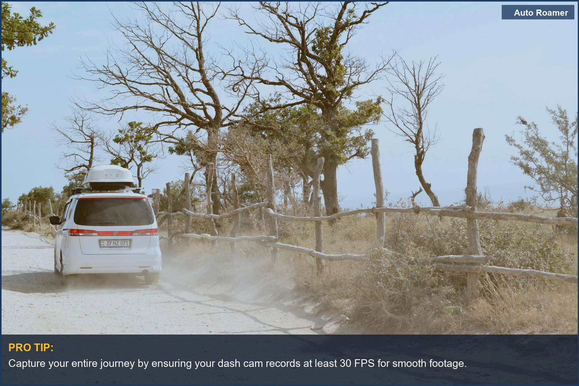 White SUV driving on a sunny dirt road, showcasing essential dash cam features for SUV camping.