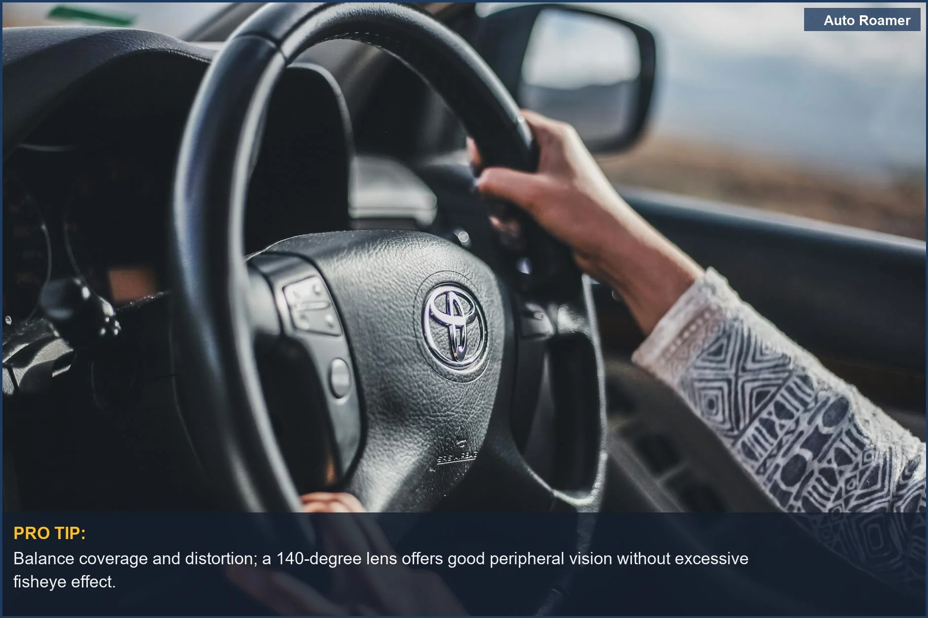 Hands gripping steering wheel in moving car, demonstrating focus and control for dash cam coverage.