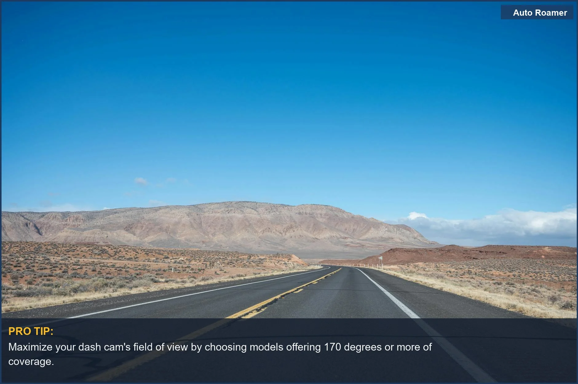 Expansive desert landscape leading to mountains, demonstrating the need for a wide angle dash cam for towing.
