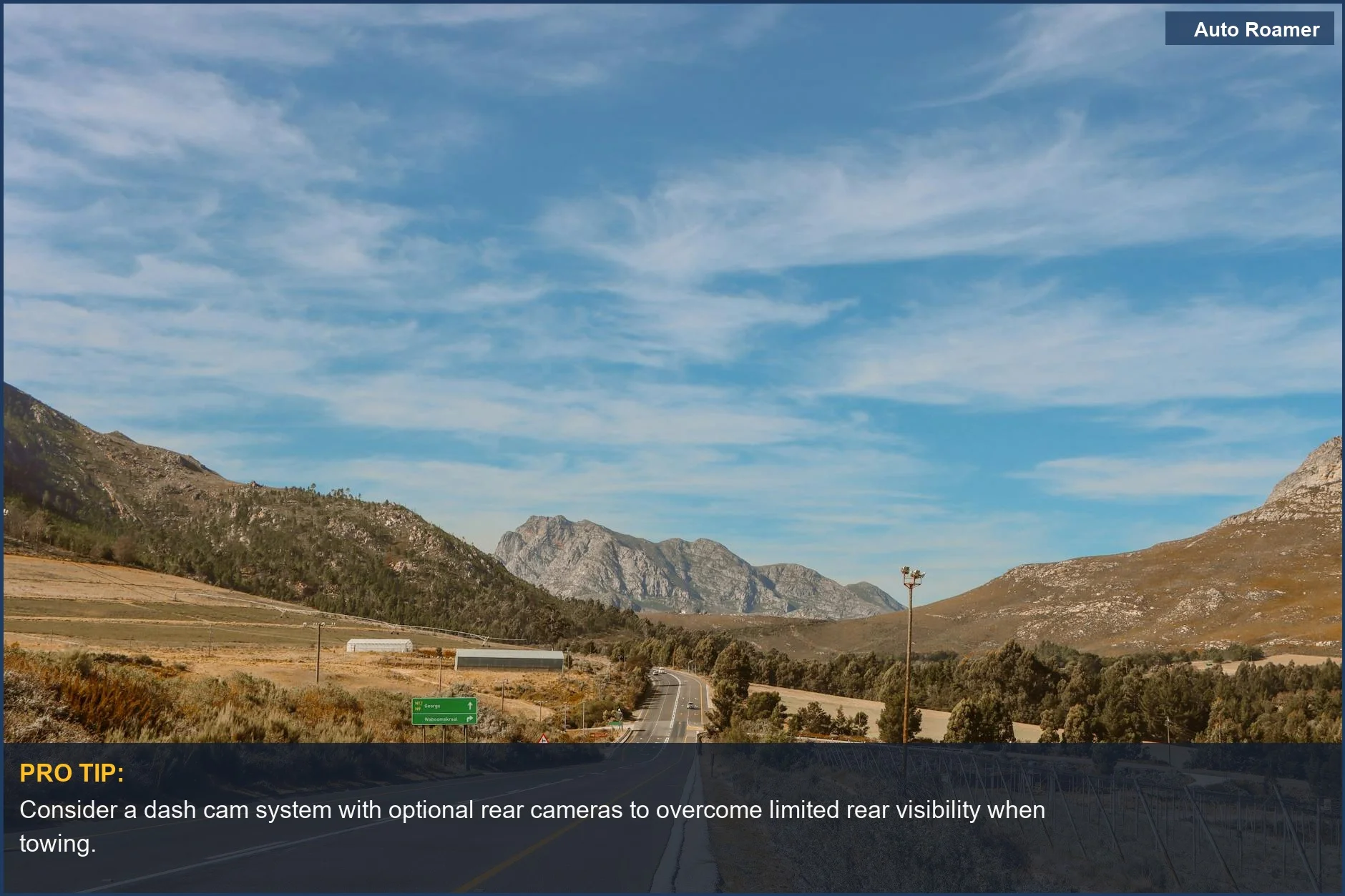 Stunning mountain highway vista perfect for road trips, emphasizing the importance of towing visibility.