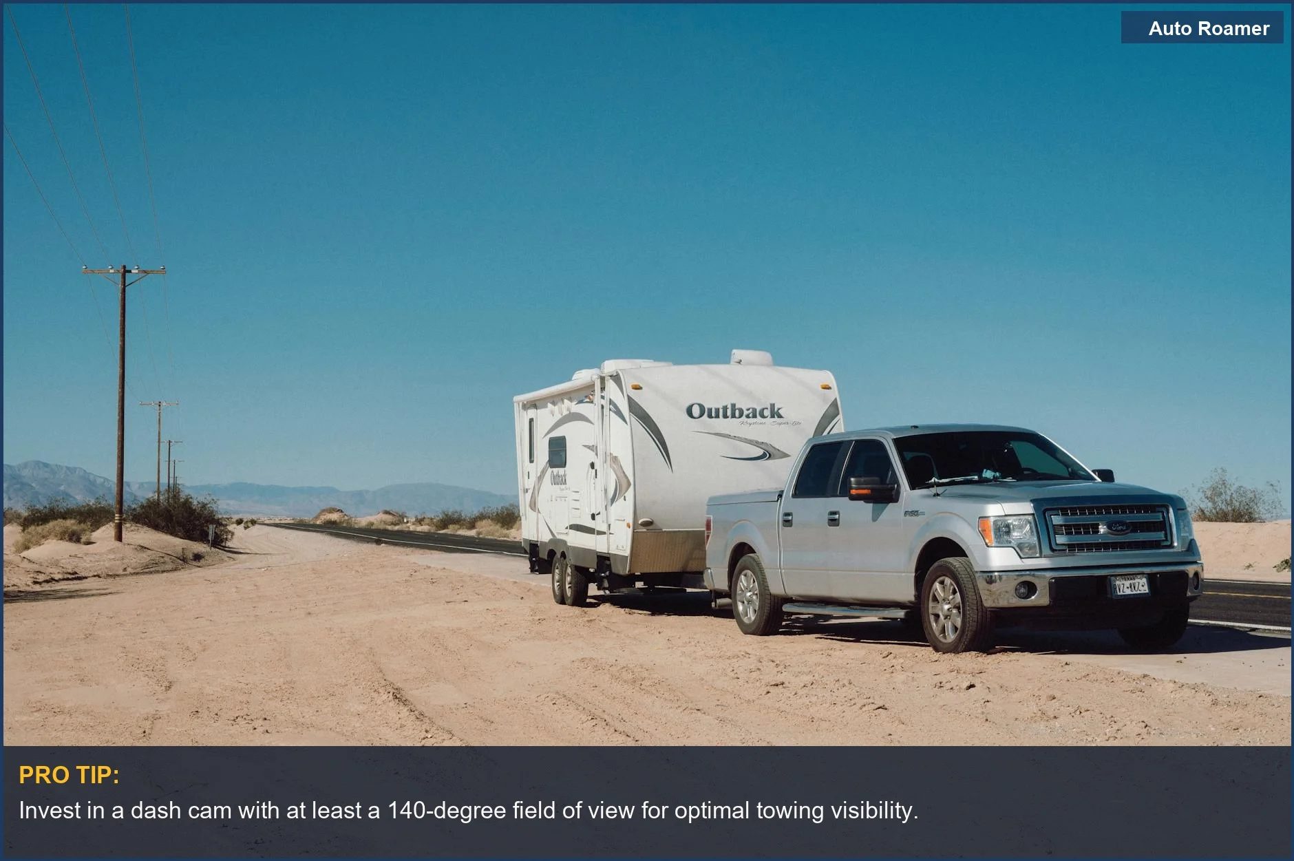 Wide angle dash cam view of a silver truck towing an RV trailer on a scenic desert highway.