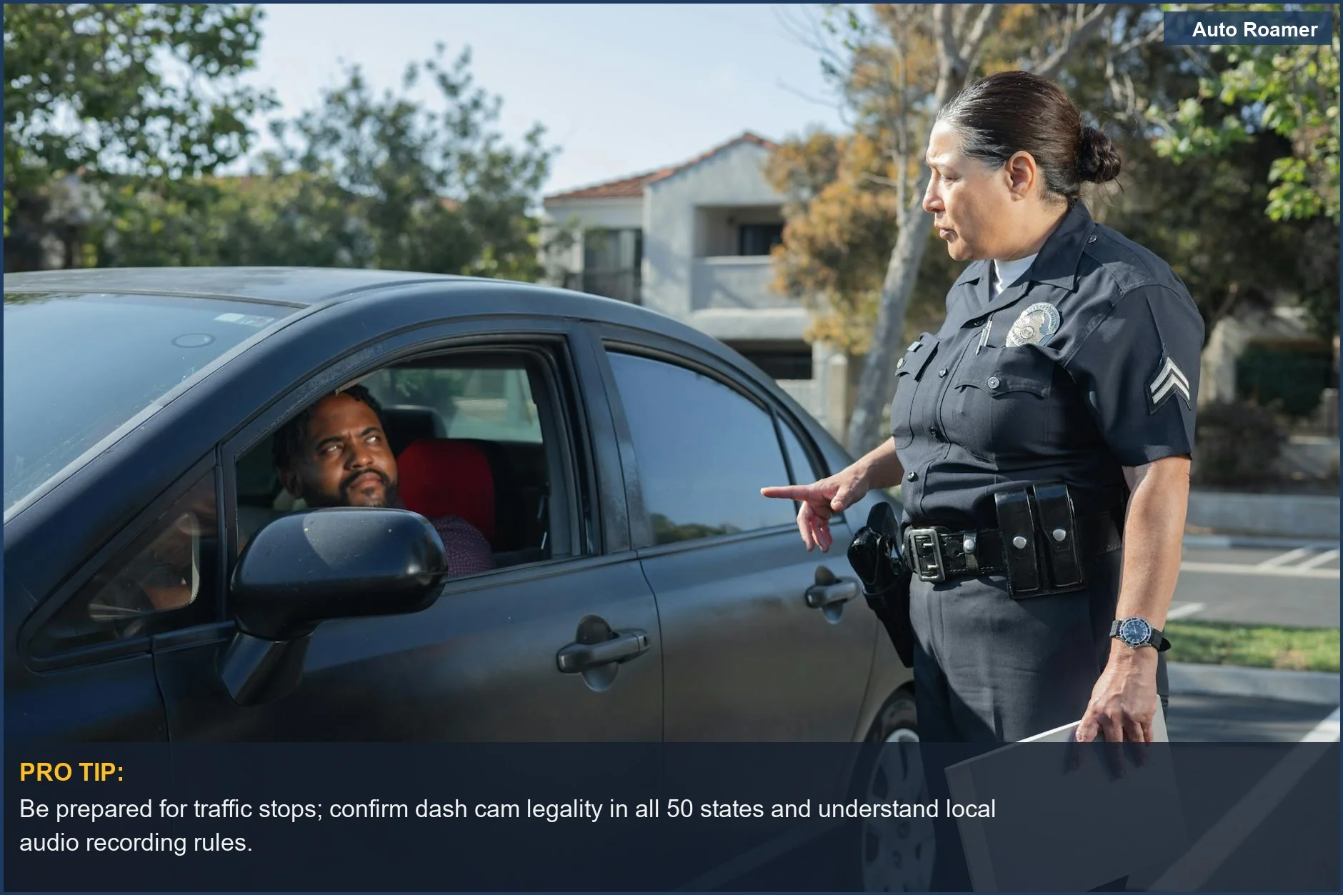 Police officer talking to a driver during a traffic stop, emphasizing the need to know dash cam legality nationwide.