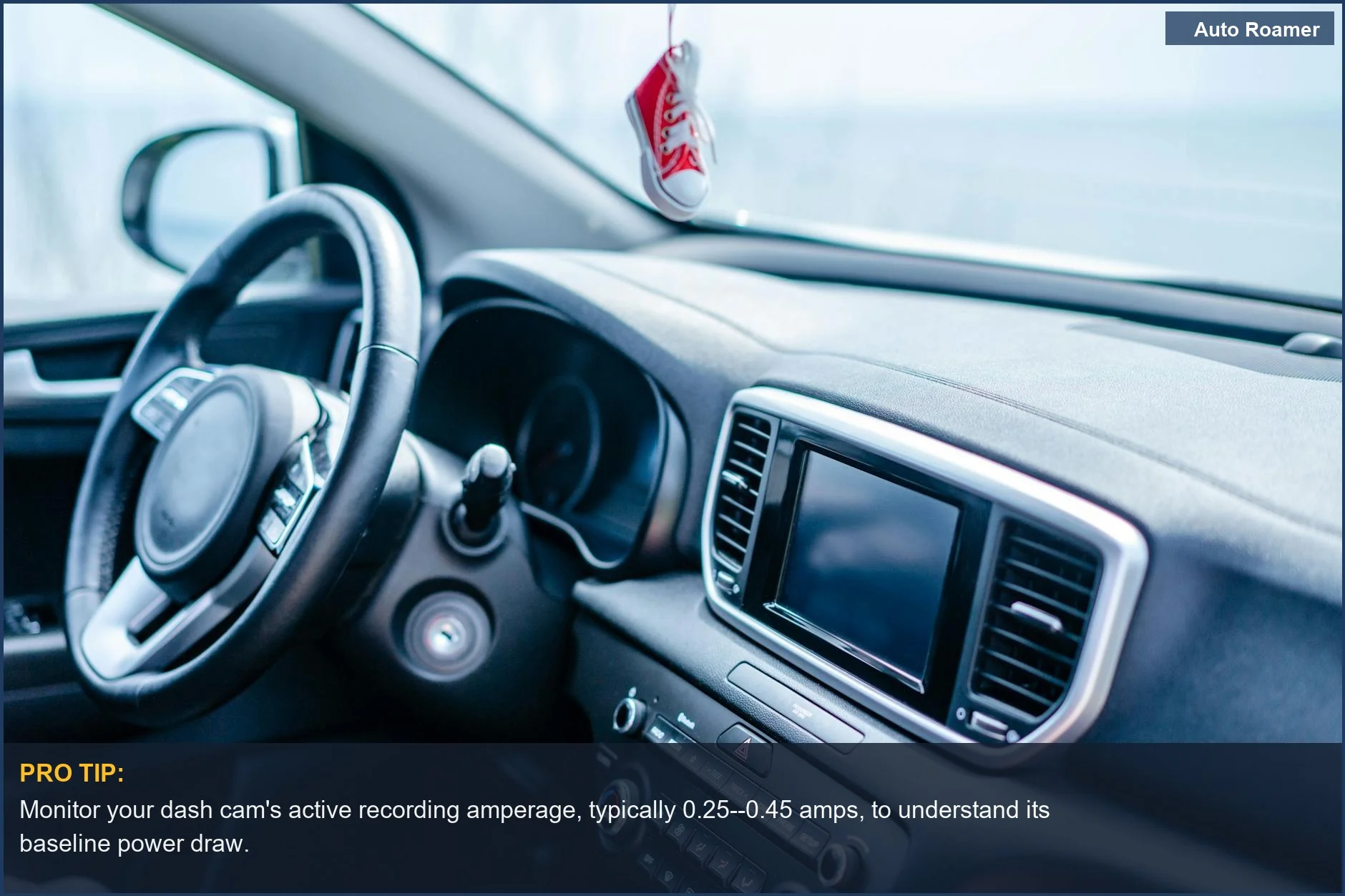 Modern car interior with a focus on the steering wheel and dashboard, illustrating dash cam power consumption.