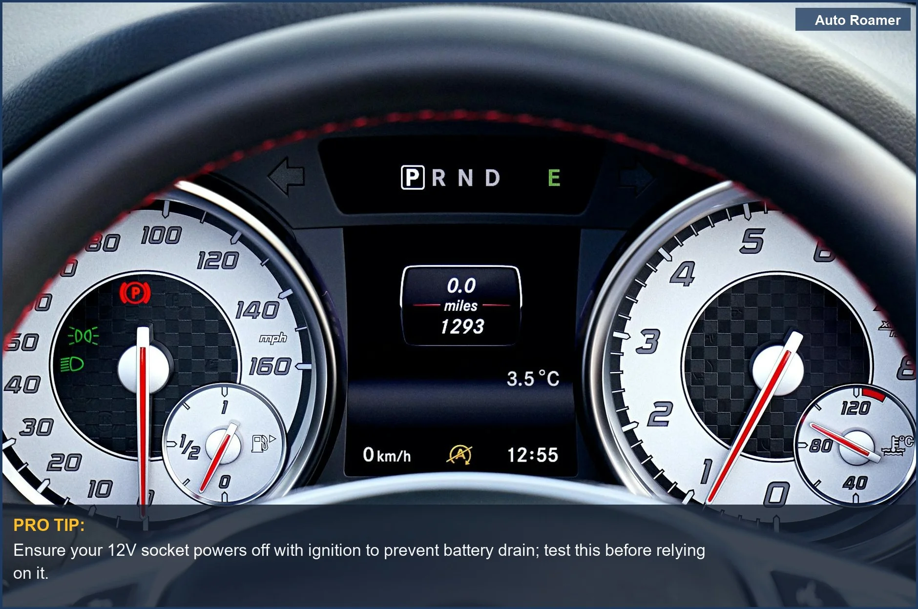 Close-up of a modern car dashboard, highlighting the speedometer and 12V socket for powering dash cams.