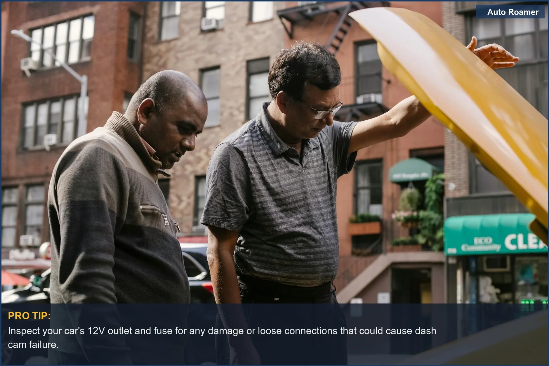 Mechanic inspecting a car engine, highlighting potential power connection issues for dash cam problems.