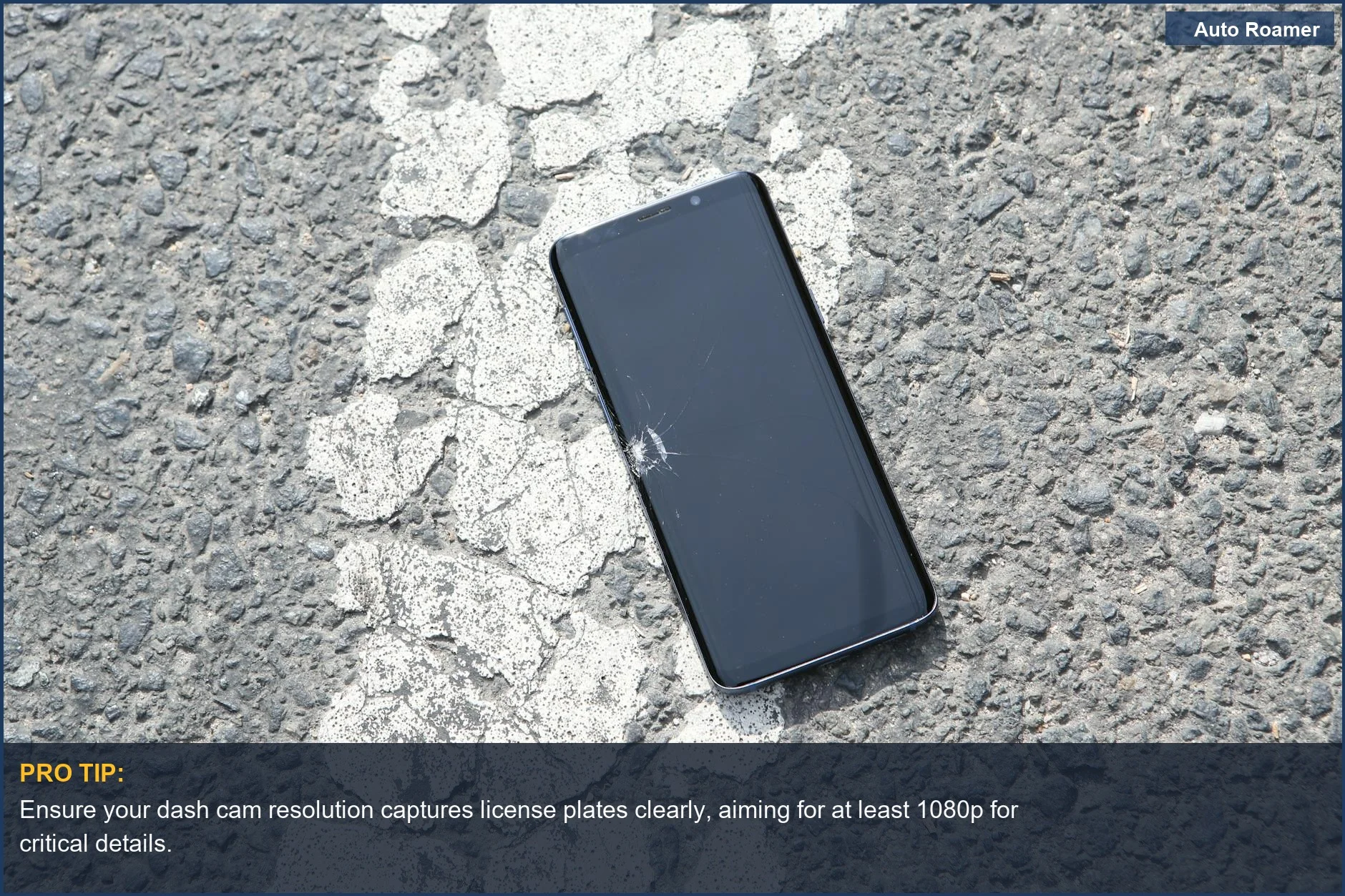 Cracked smartphone on asphalt suggesting the need for clear dash cam video quality to document incidents.