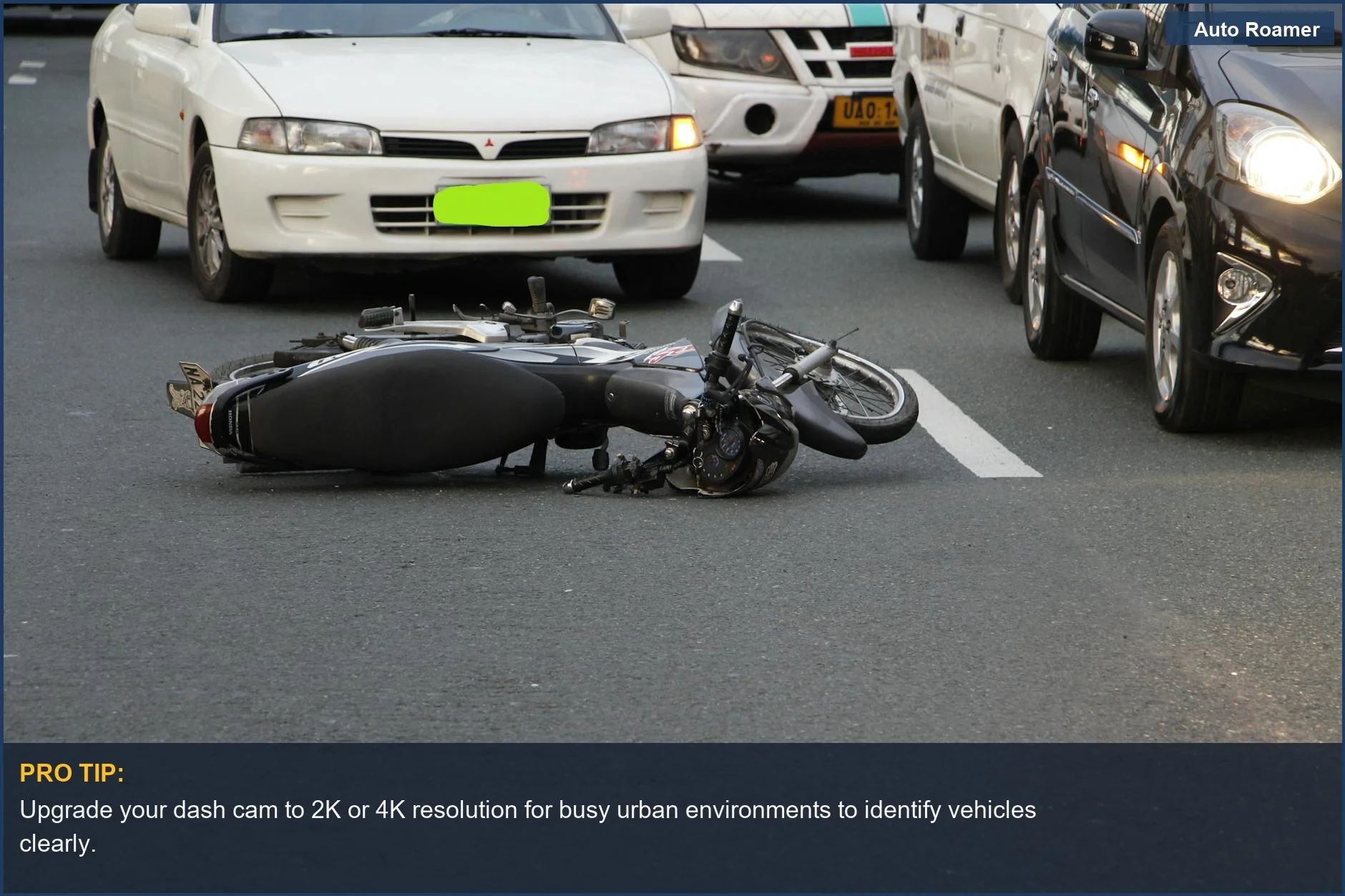 Motorcycle accident on a busy city street emphasizes the need for high dash cam resolution in traffic.