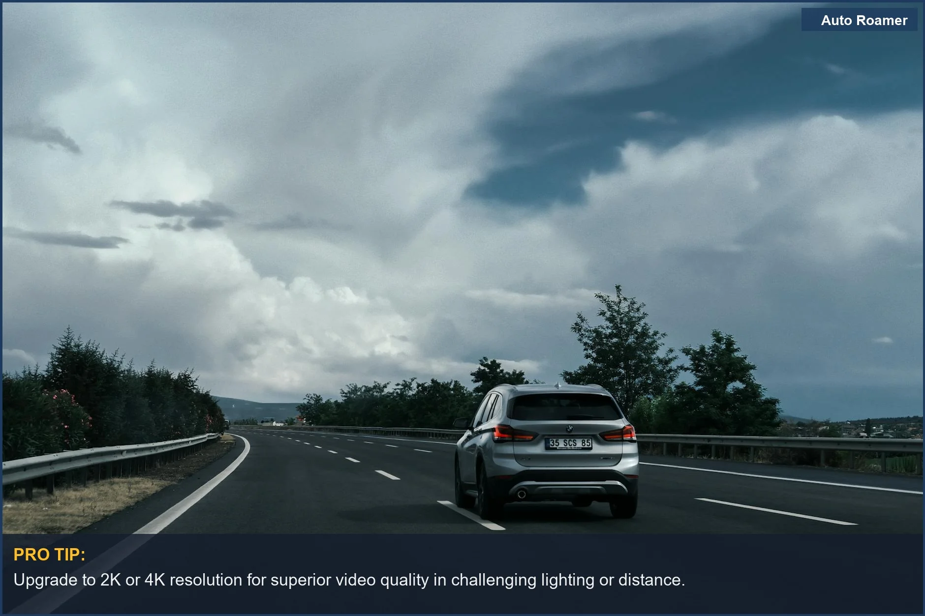 Silver SUV driving on a scenic highway, demonstrating the need for clear video quality from dash cam resolution.