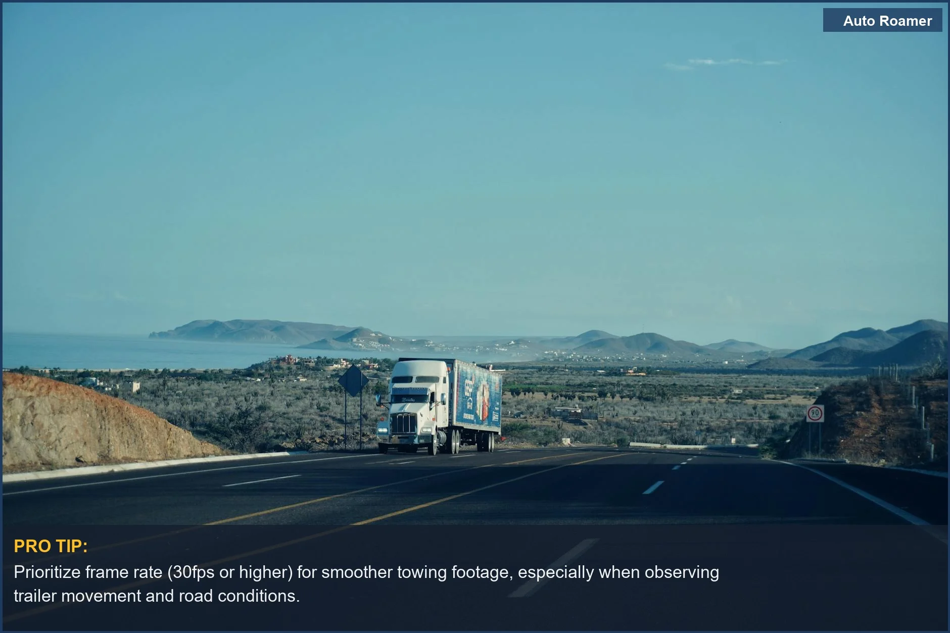 Scenic highway with mountains and a semi-truck, emphasizing video quality for understanding towing scenarios.
