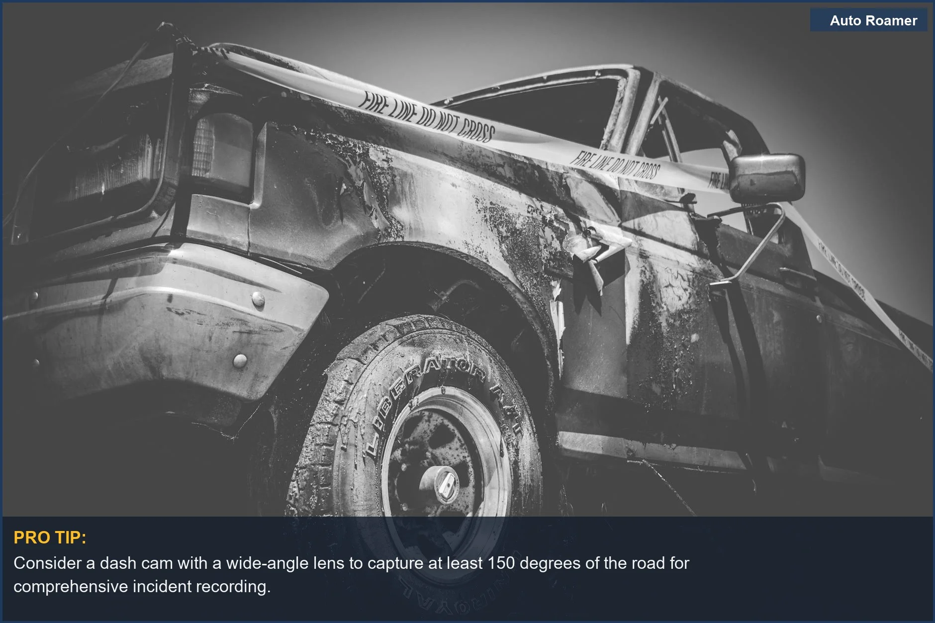 Dramatic black and white image of a damaged truck with police tape, emphasizing the need for dash cam insurance to protect against unfair blame.