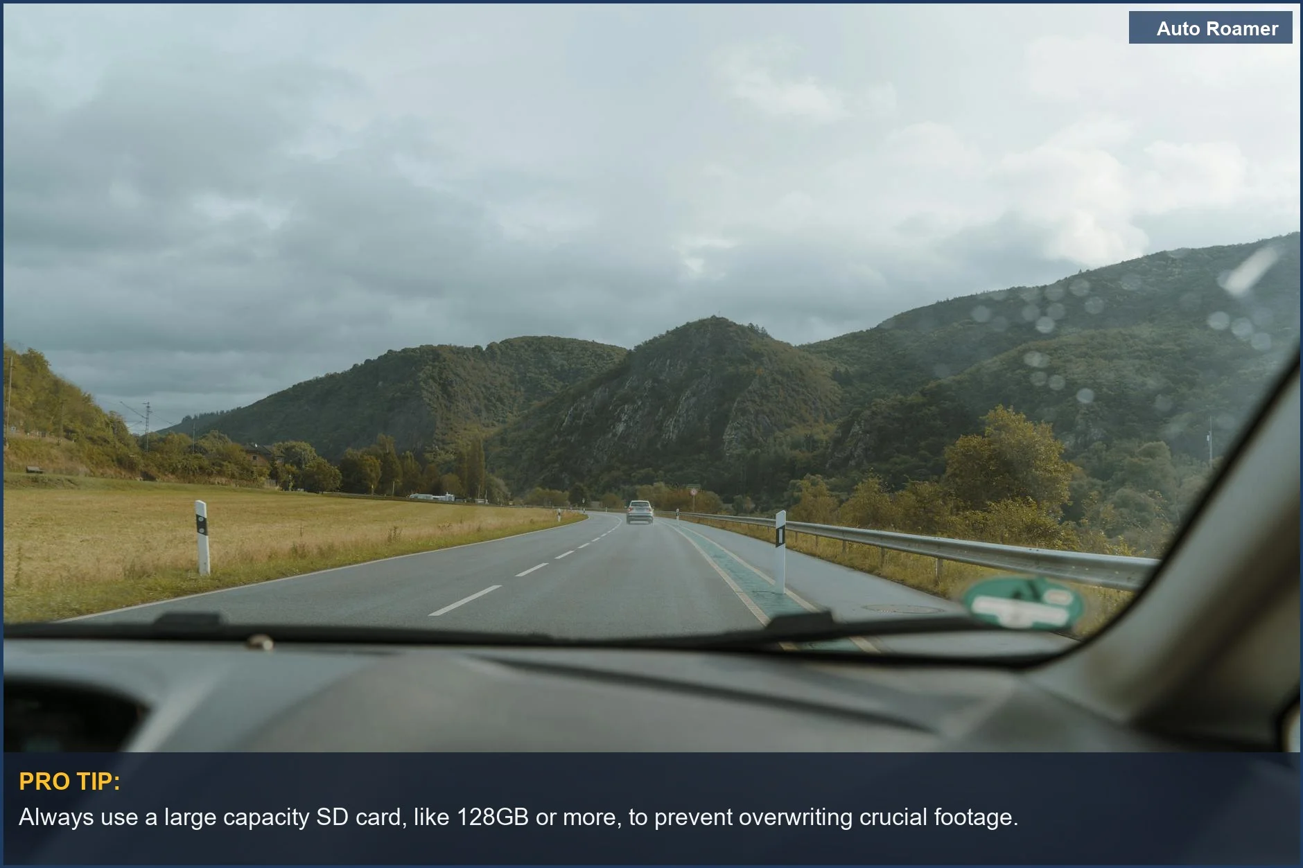 Scenic mountain road drive from a car window, highlighting dash cam storage importance.