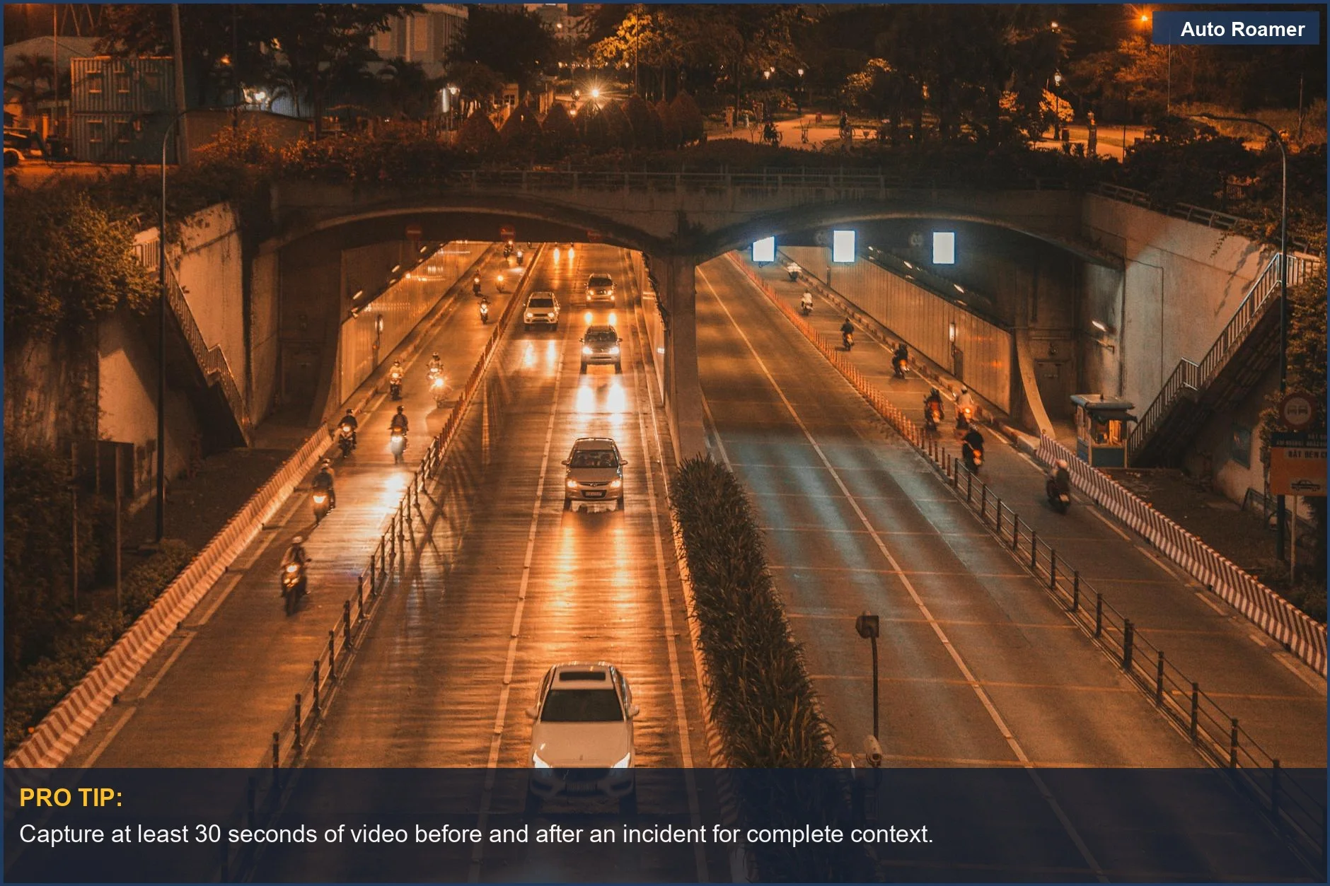 Urban highway at night with cars and motorbikes, showcasing dash cam night vision capabilities.