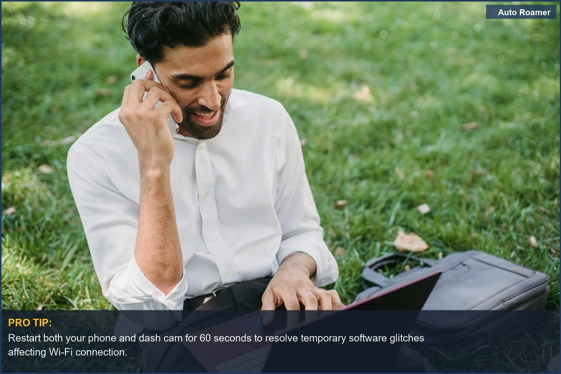 Man in a park using laptop and phone, symbolizing the need for a stable connection when a dash cam won't connect to Wi-Fi remotely.