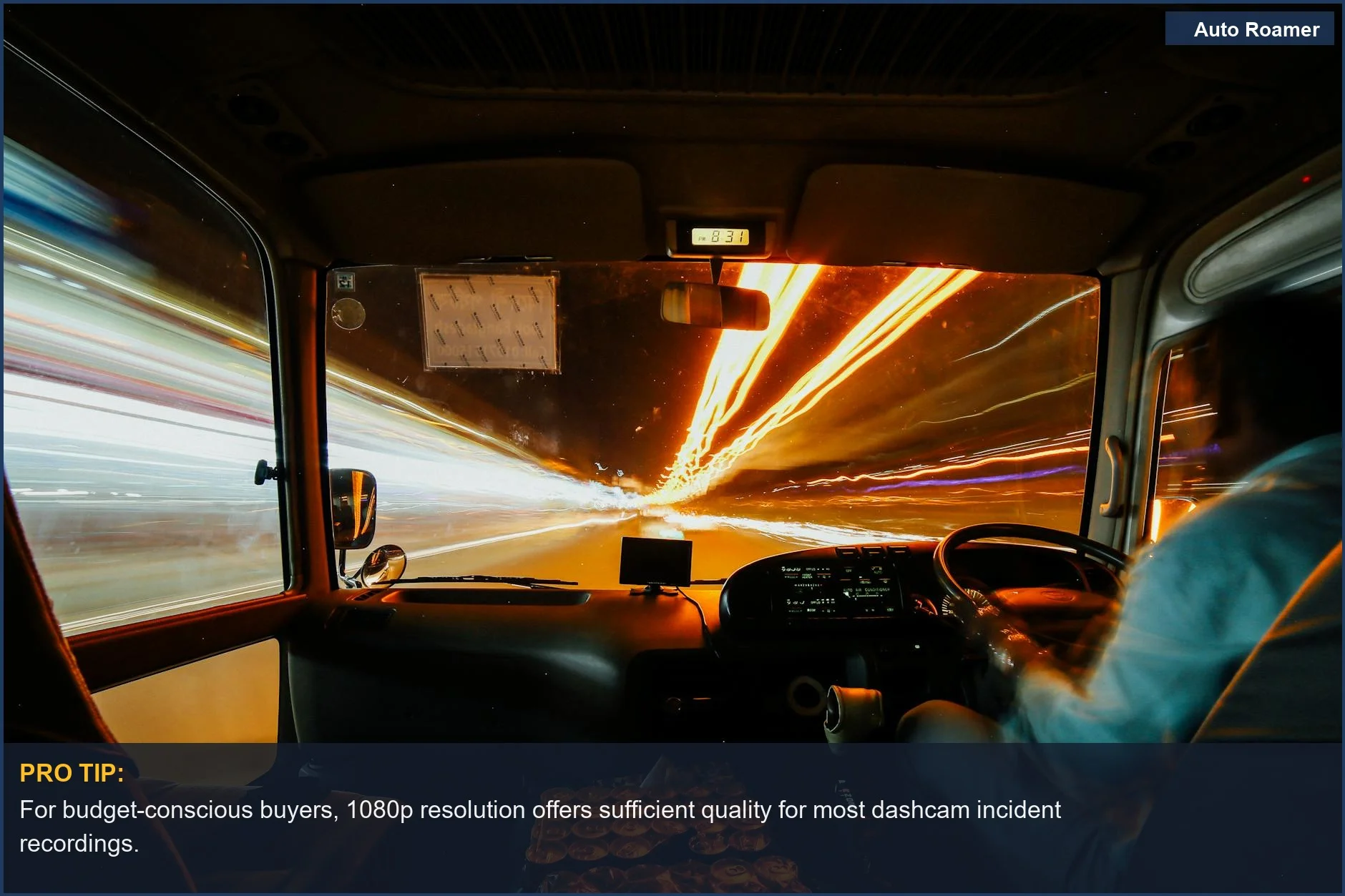 Nighttime city drive from car interior, illustrating speed and urban lights for dashcam considerations.