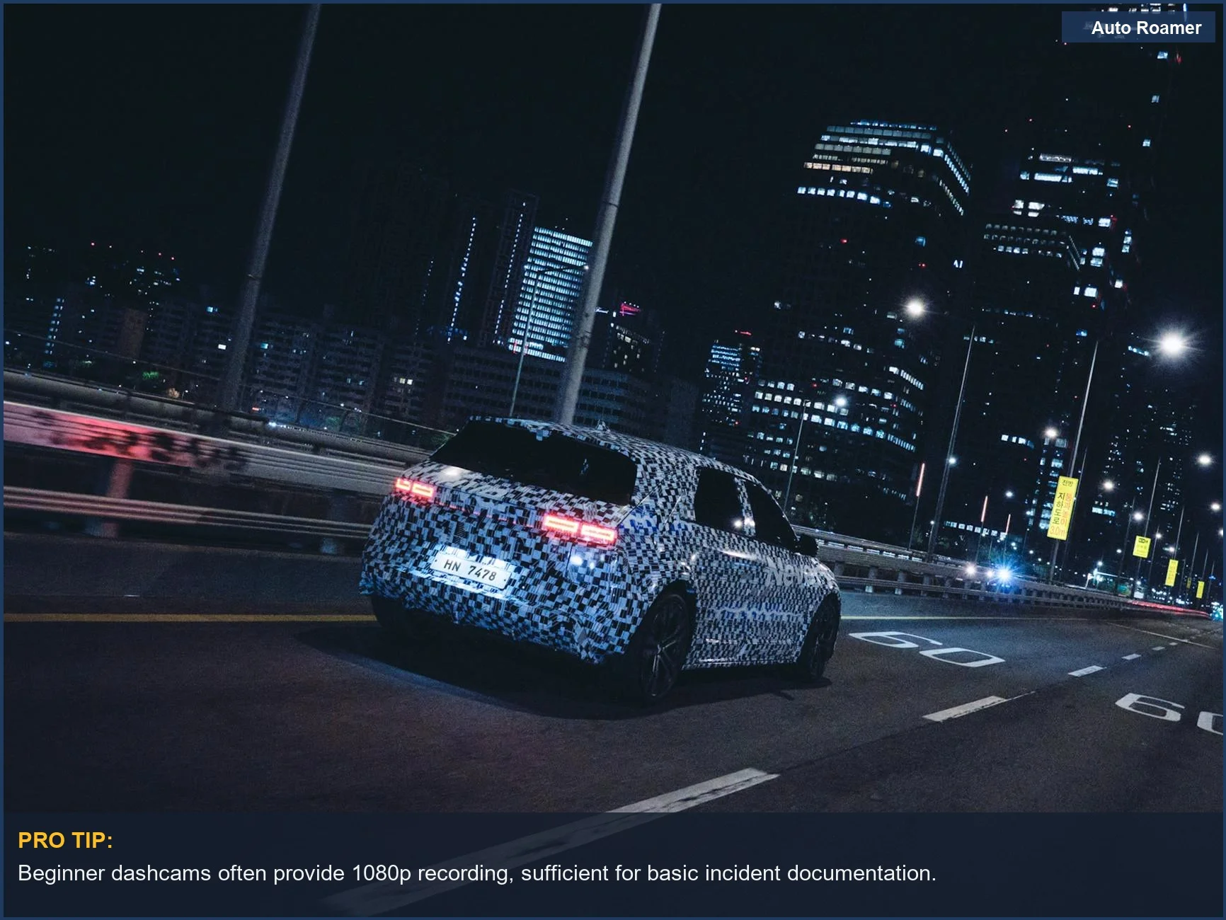 Futuristic electric car with camo wrap at night, informing dashcam comparison chart budget choices.