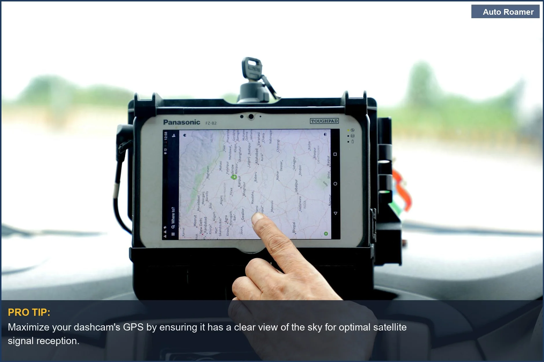 Hand using GPS navigation on a car tablet, illustrating dashcam GPS functionality for precise location logging.