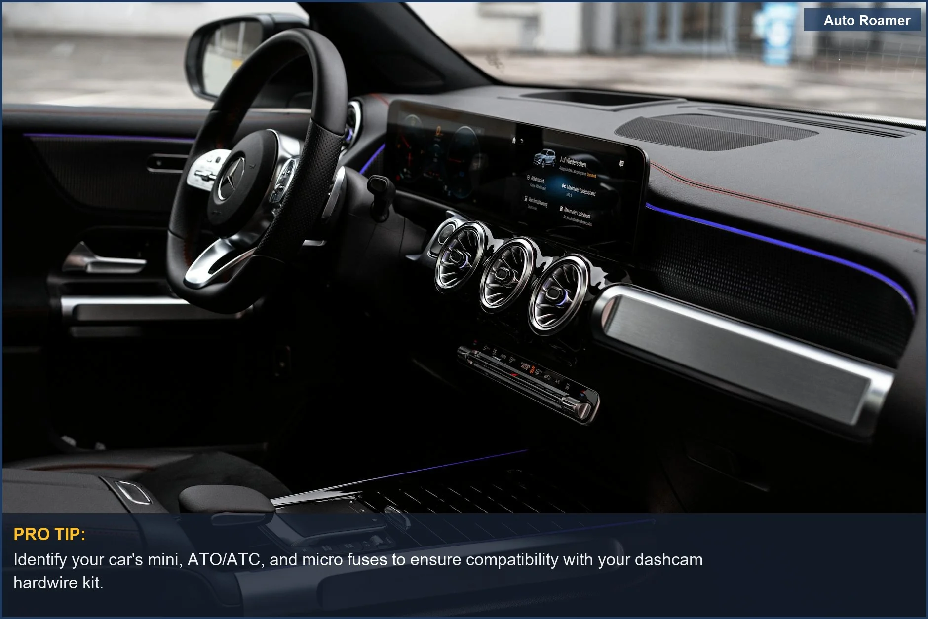 Modern car interior with digital dash showcasing various automotive fuse types for dashcam hardwiring kits.