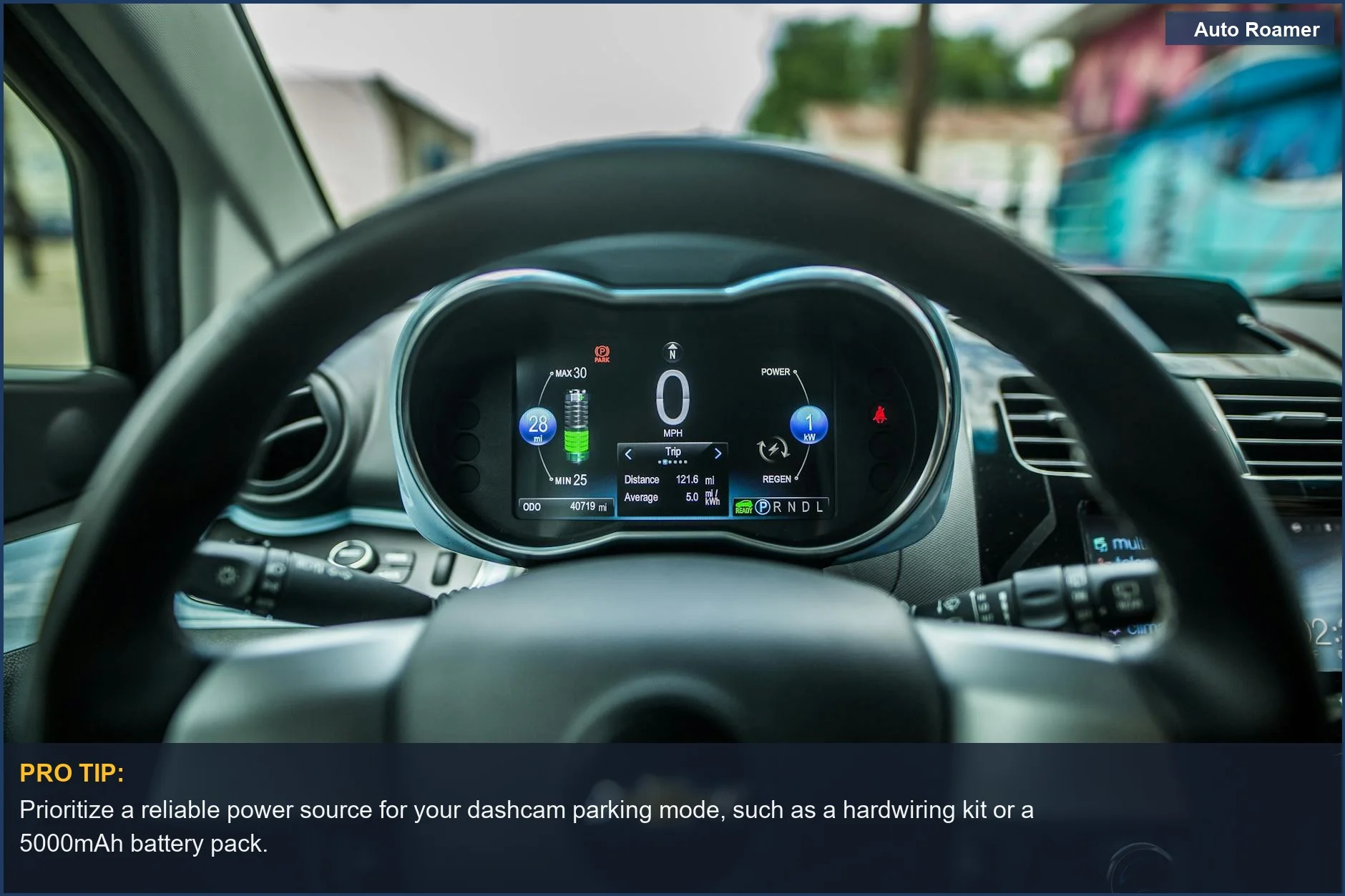 Close-up of a car's dashboard with a digital display and steering wheel, essential for dashcam parking mode power.