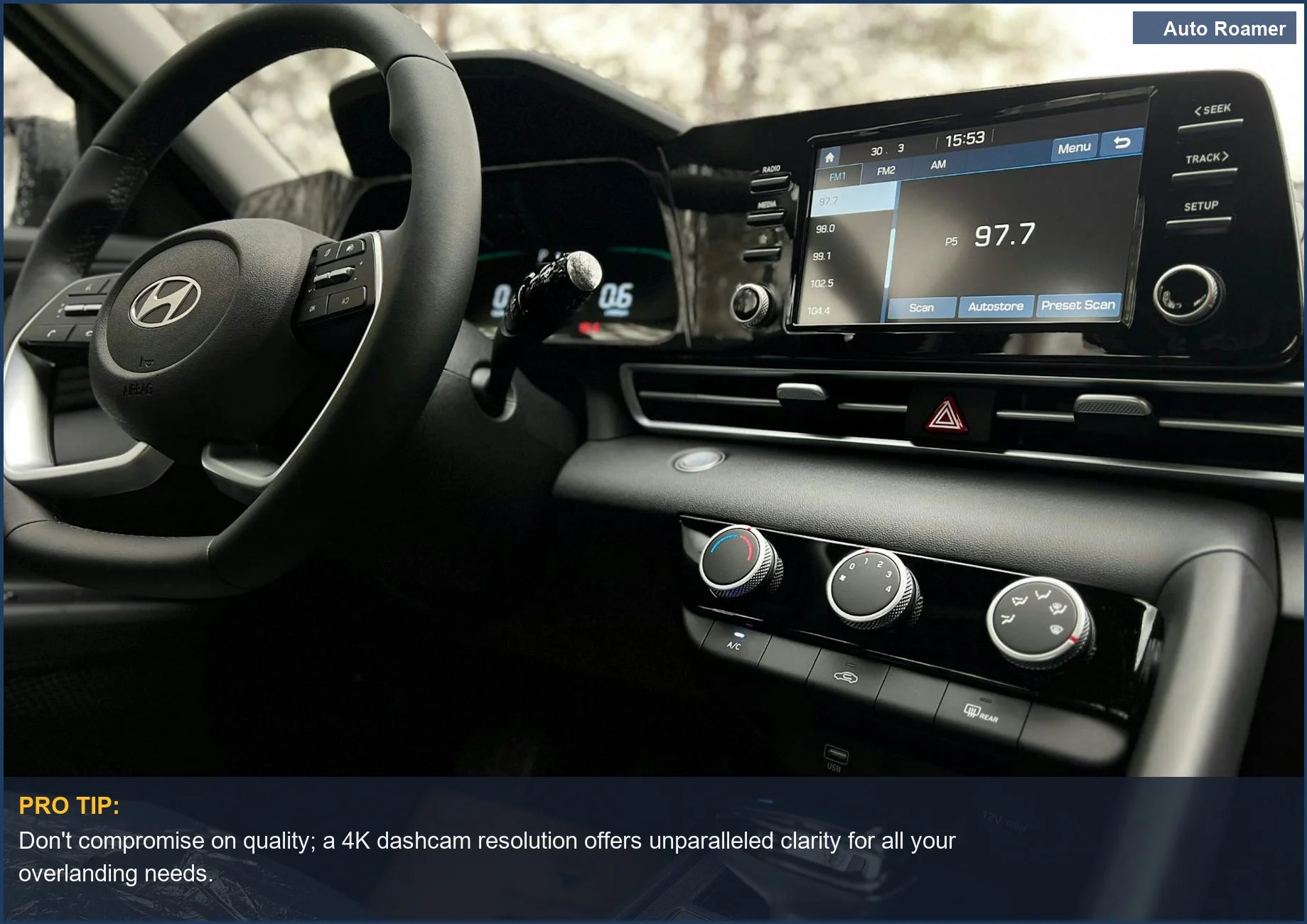 Interior of a modern car dashboard with touchscreen and steering wheel, emphasizing dashcam clarity for overlanding.