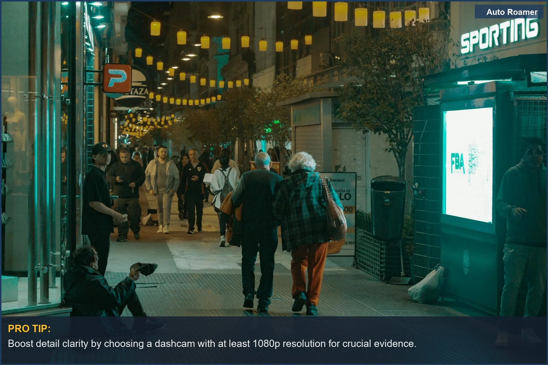 Nighttime Buenos Aires street scene with vibrant lights, illustrating the importance of dashcam resolution for detail.