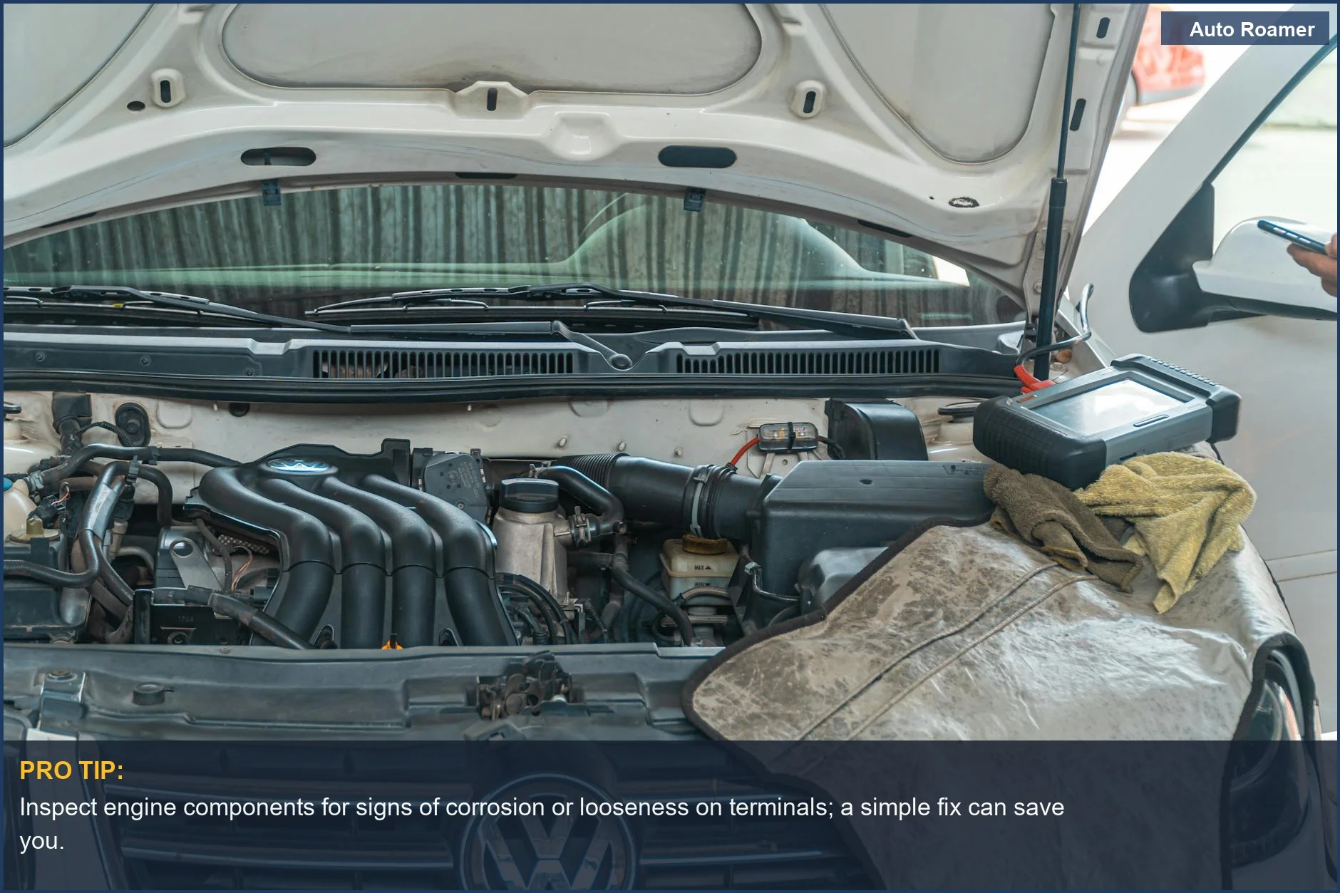 Mechanic uses diagnostic tools on a Volkswagen engine, illustrating a dead battery vs. alternator problem.