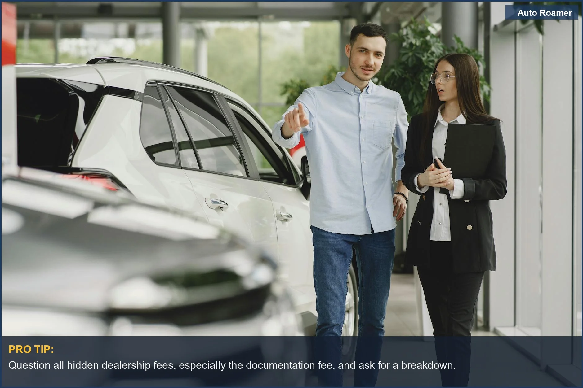 Customer and salesperson review vehicle details, illustrating the hidden dealership fees and negotiation points.