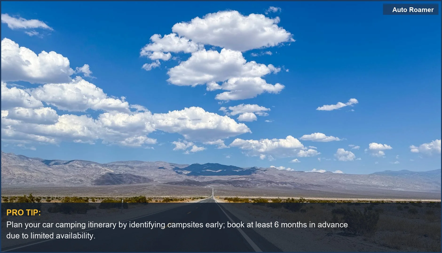 An endless road stretching through Death Valley's desert with mountains under a clear blue sky.