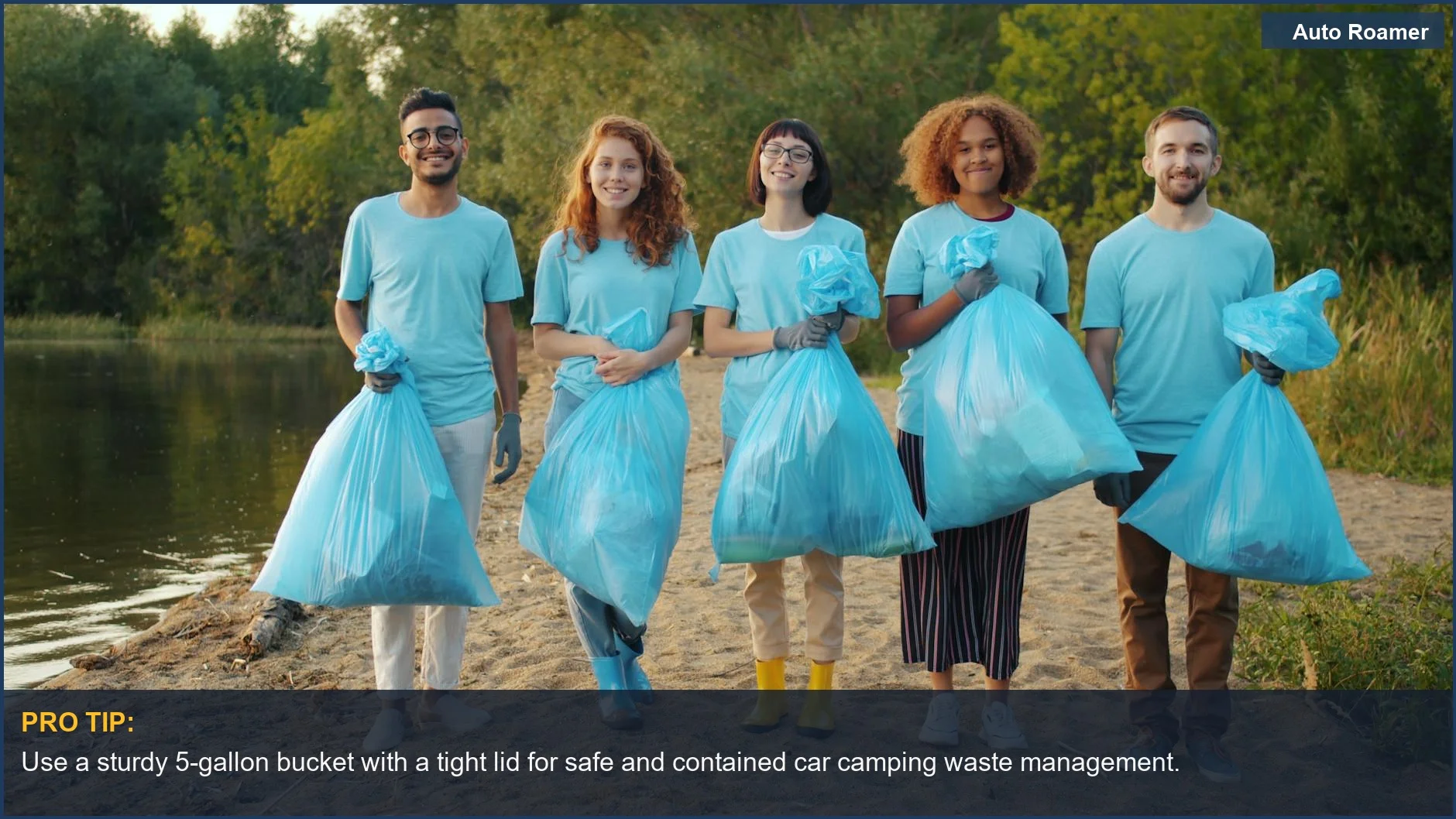 Diverse volunteers in blue shirts cleaning a riverbank, emphasizing car camping waste management.
