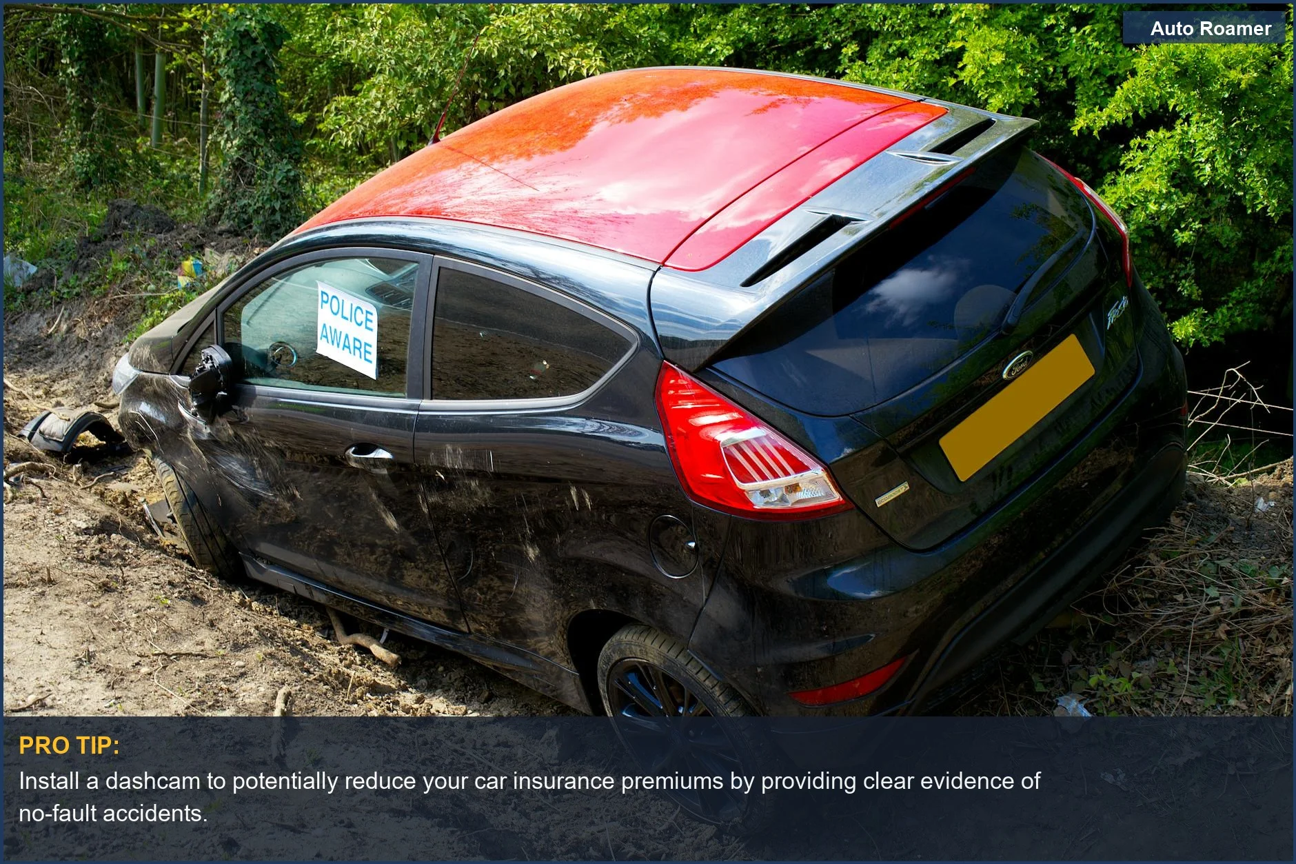 Damaged Ford Fiesta with 'Police Aware' sign on a dirt road in the UK, highlighting dashcam's role in accident disputes.