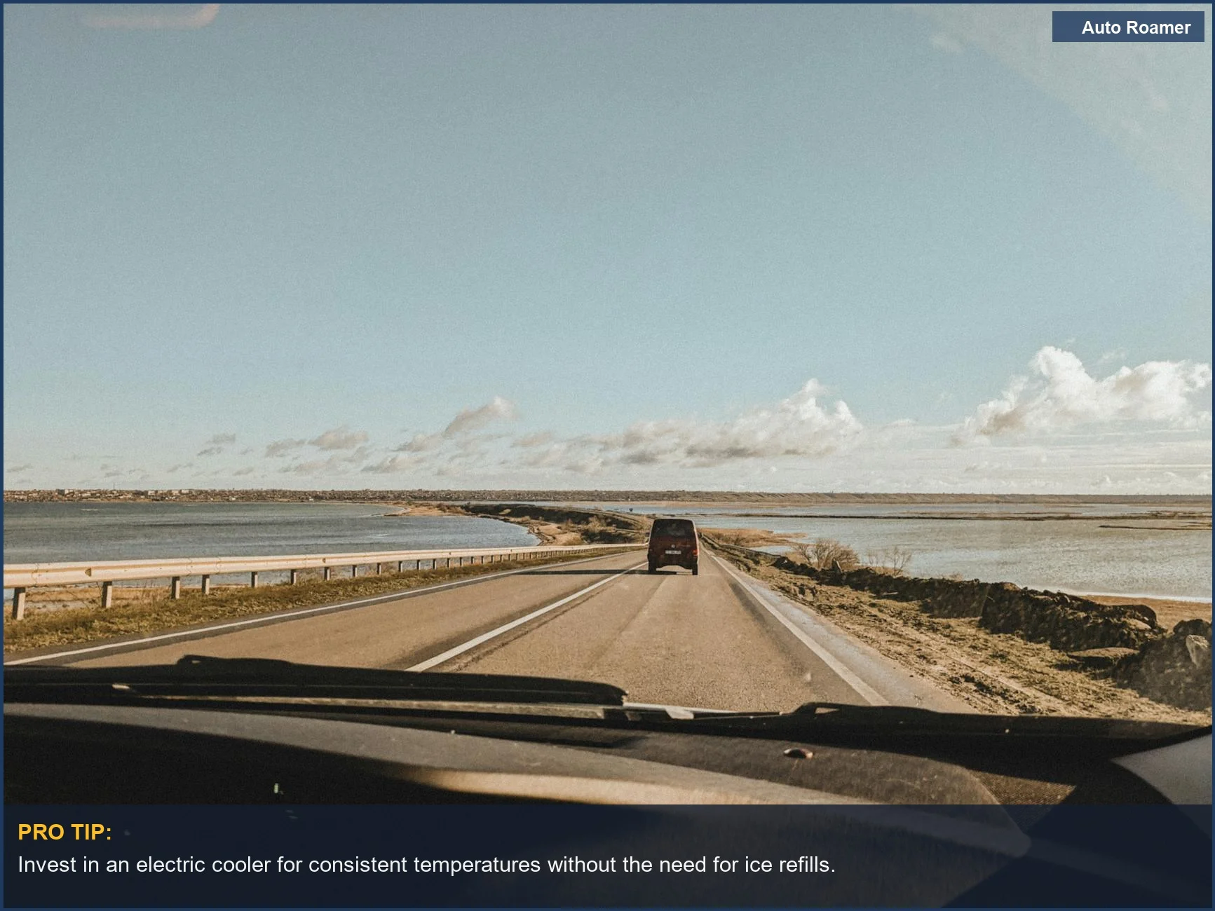 Coastal drive with serene waters, showcasing the benefits of portable fridge vs cooler for road trips.