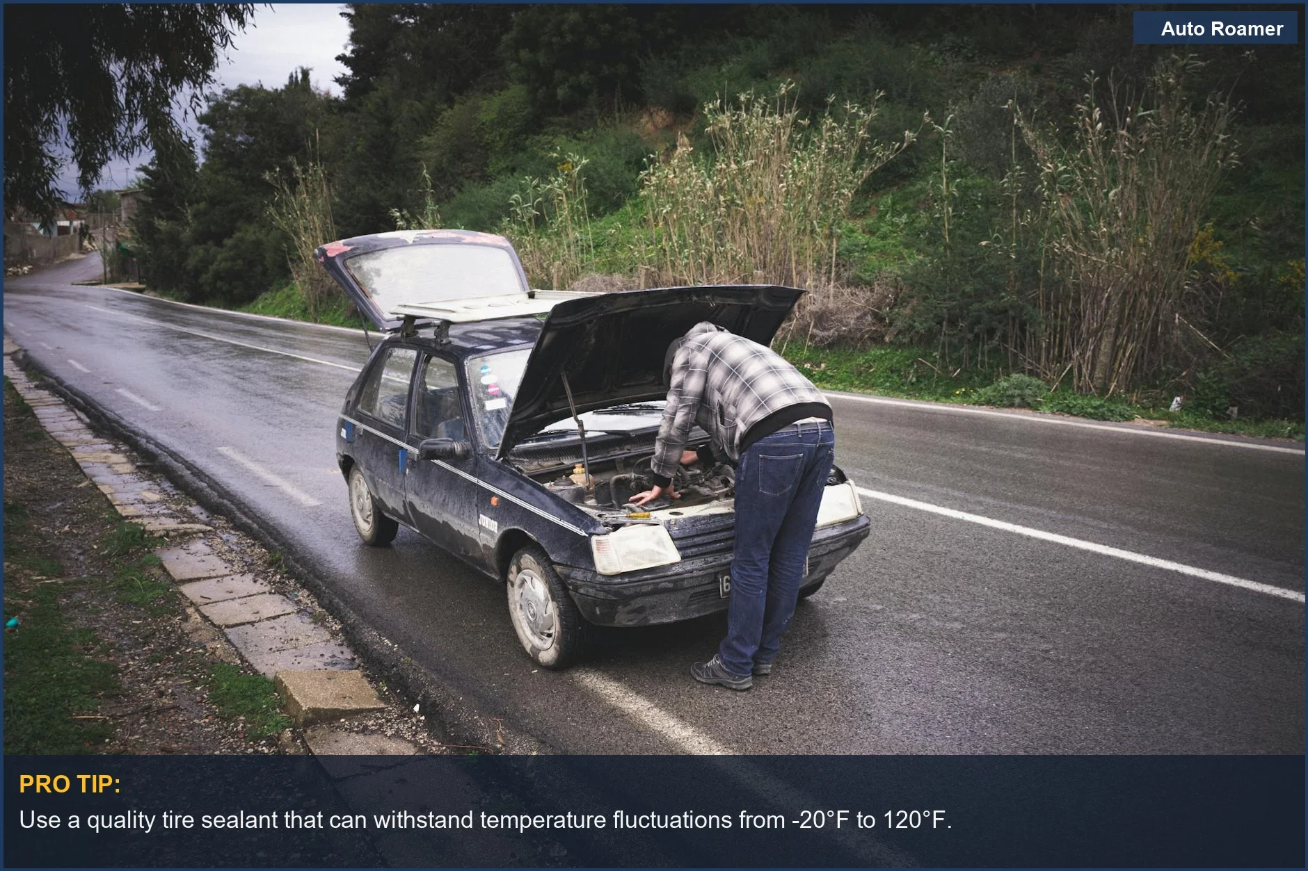 Individual fixing a car on a rainy road, emphasizing urgent roadside vehicle maintenance essentials.