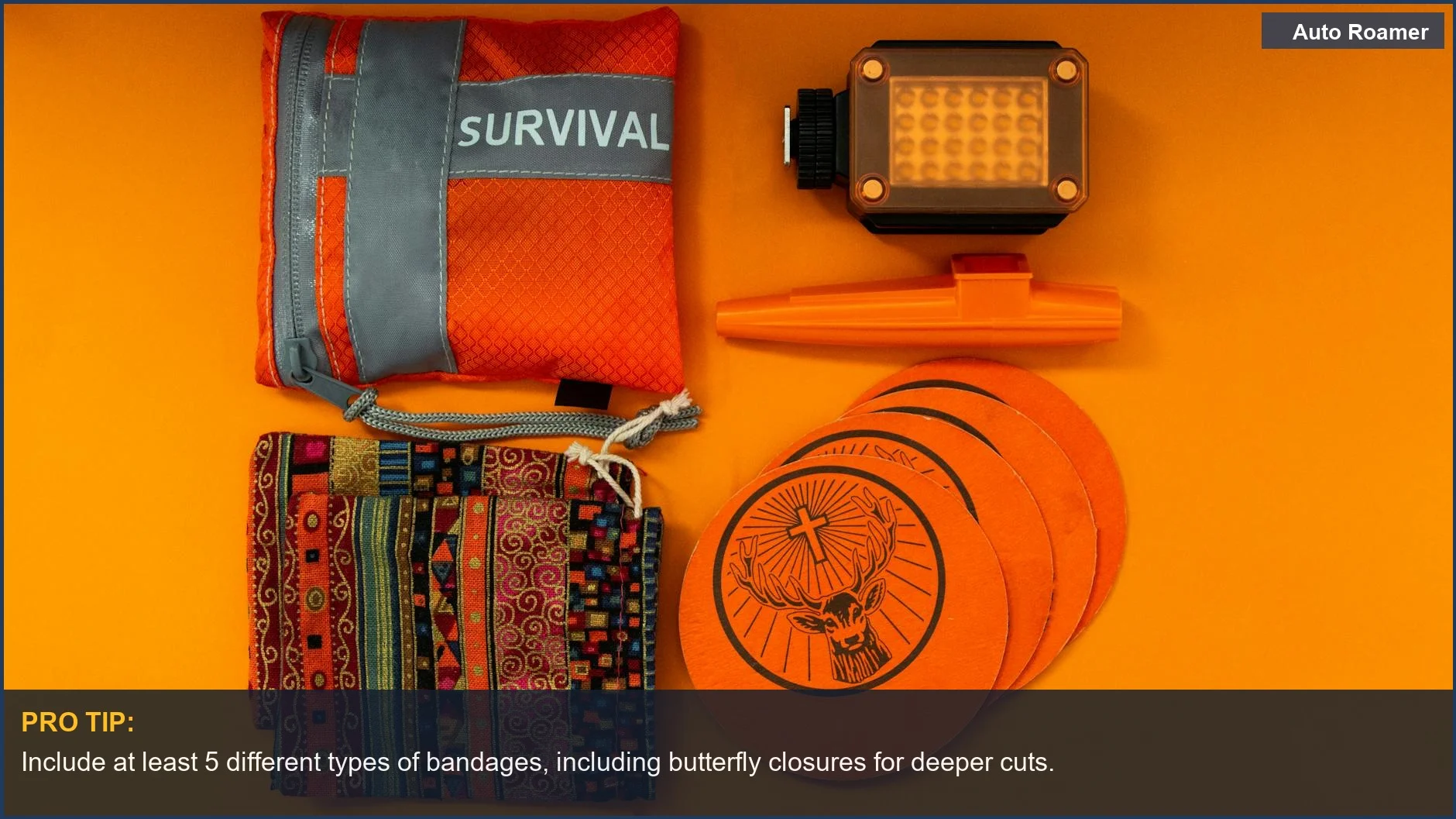 Colorful camping medical supplies laid out on an orange background, highlighting vibrant items.