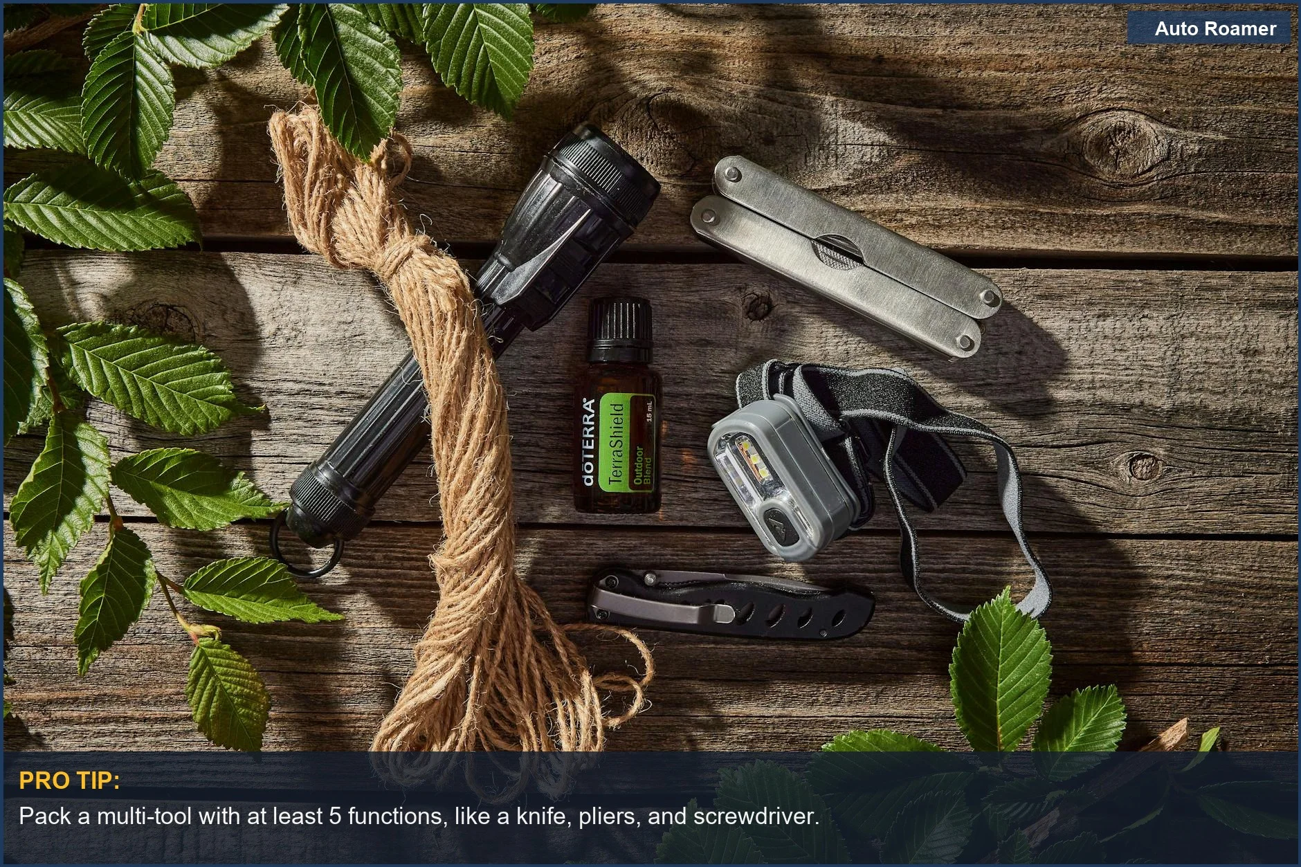 Collection of outdoor essentials for a road trip safety kit on a wooden surface.