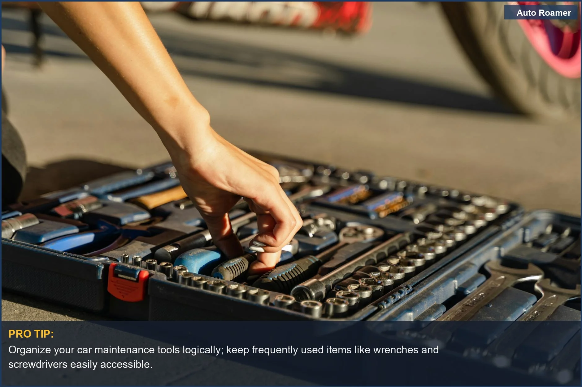 Hand selecting a wrench from a well-organized toolbox, highlighting essential auto tools.