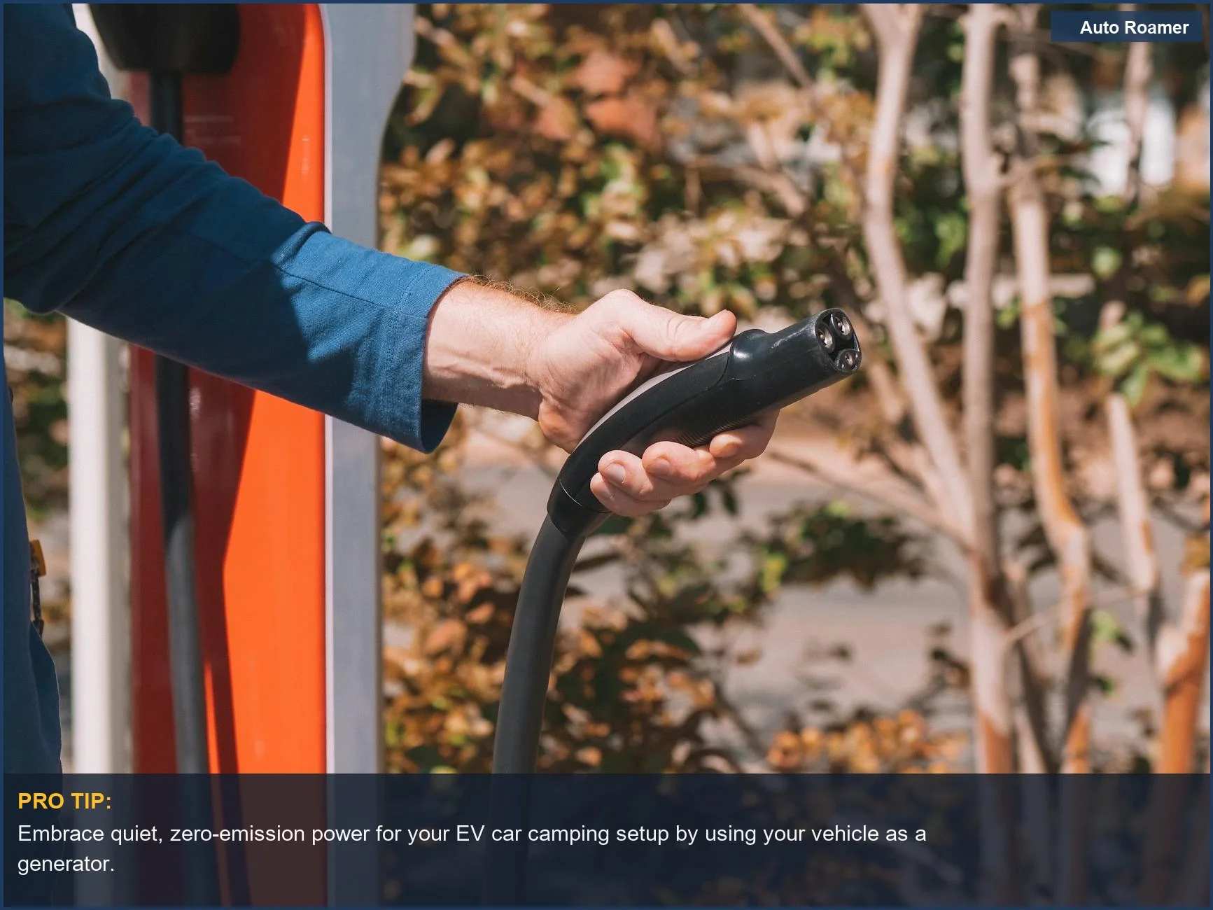 Hand connecting an EV charger to a car, symbolizing clean energy for car camping.