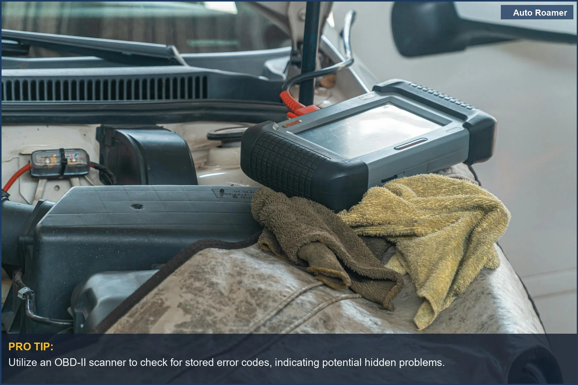 Close-up of car diagnostics tool on engine, vital for evaluating hidden safety issues in used vehicles.